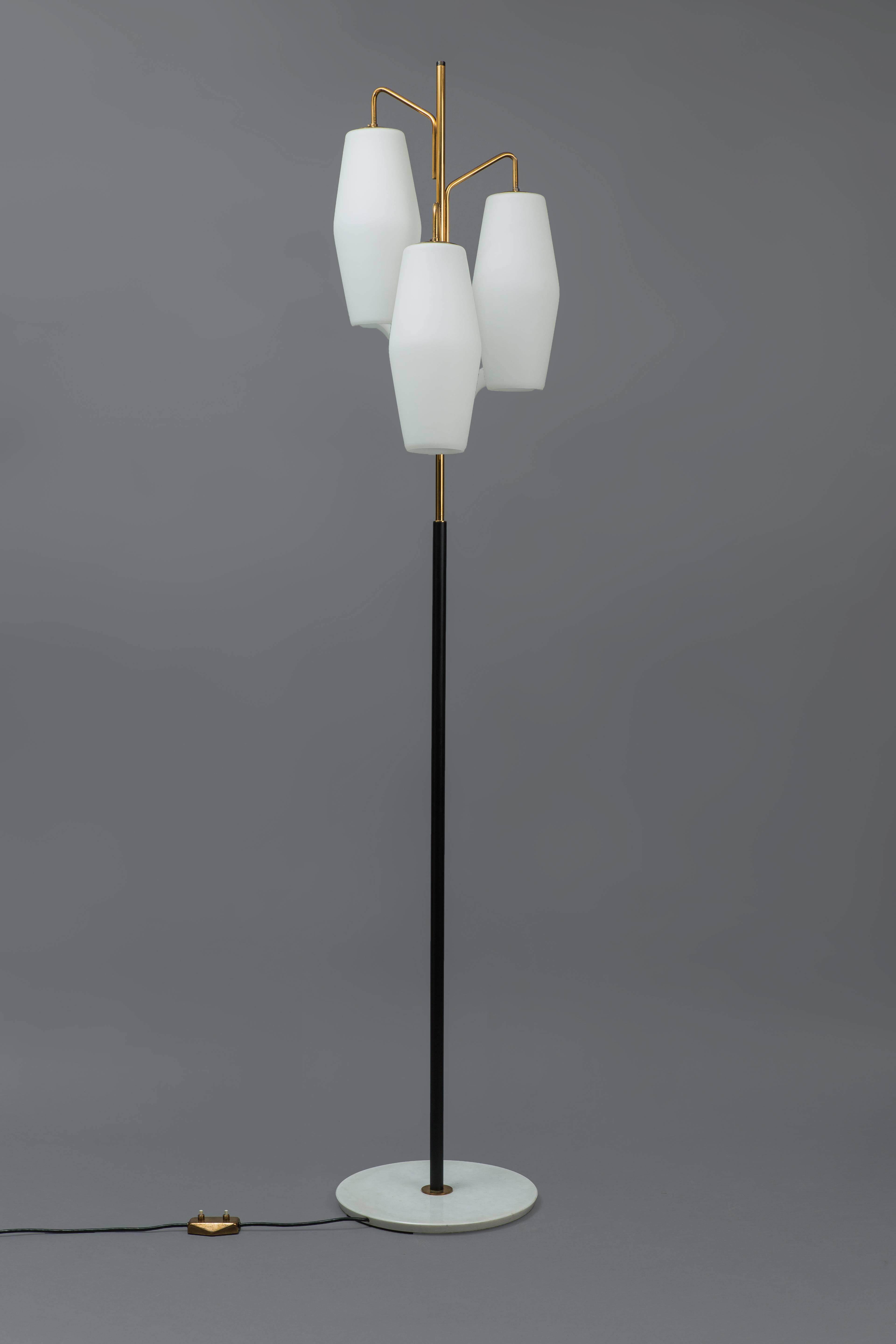 Opaline glass shades suspended on gilt lacquer and black painted metal stem on white marble base with original foot switch impressed 'Stilnovo Italy' on underside and manufacturer’s label 'Stilnovo / Milano Italy' affixed to the inside of the