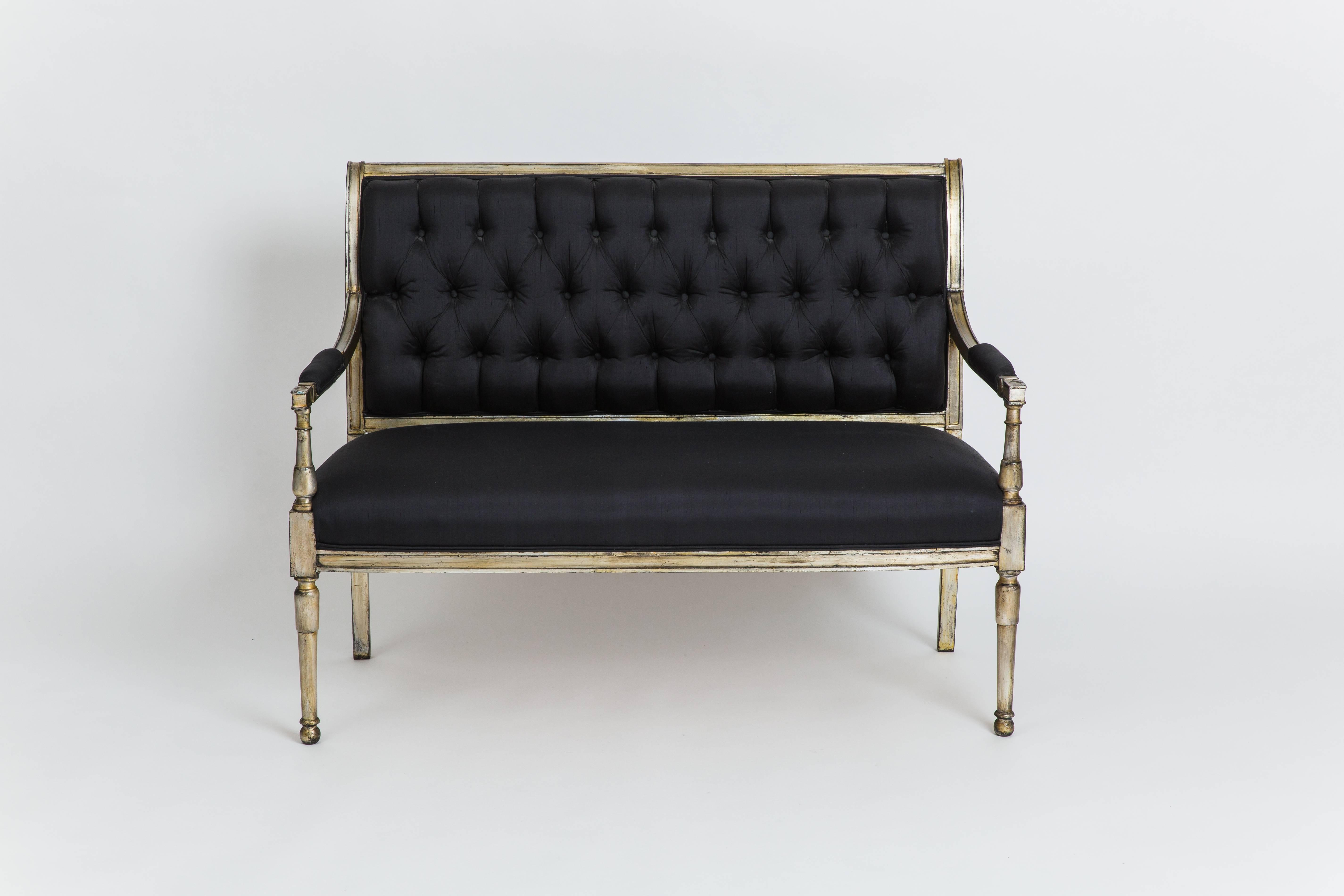 Exquisite and elegant Directoire style silver leaf settee with black raw silk upholstery on tufted back, seat and padded arms, France, 1950s. This settee was likely designed as a special commission with stamp 'JANSEN' and original label 'Monsieur