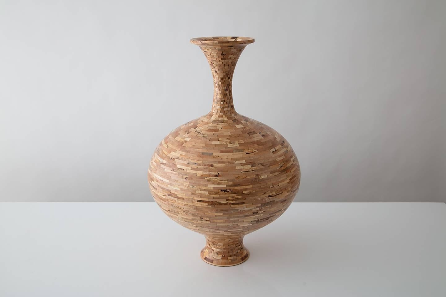 Part of Richard Haining's STACKED Collection, this vase was made using reclaimed spalted maple salvaged from the offcuts of Brooklyn Museum's seating, reception desks, and signage located in their glass pavilion lobby entrance. The wood's natural