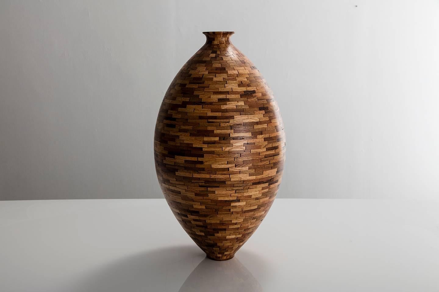 Part of Richard Haining's Stacked Collection, this asymmetrical vessel utilizes reclaimed red and white oak, as well as chestnut. The salvaged wood offcuts were sourced from a variety of local Brooklyn wood shops, as well as from deconstructed turn