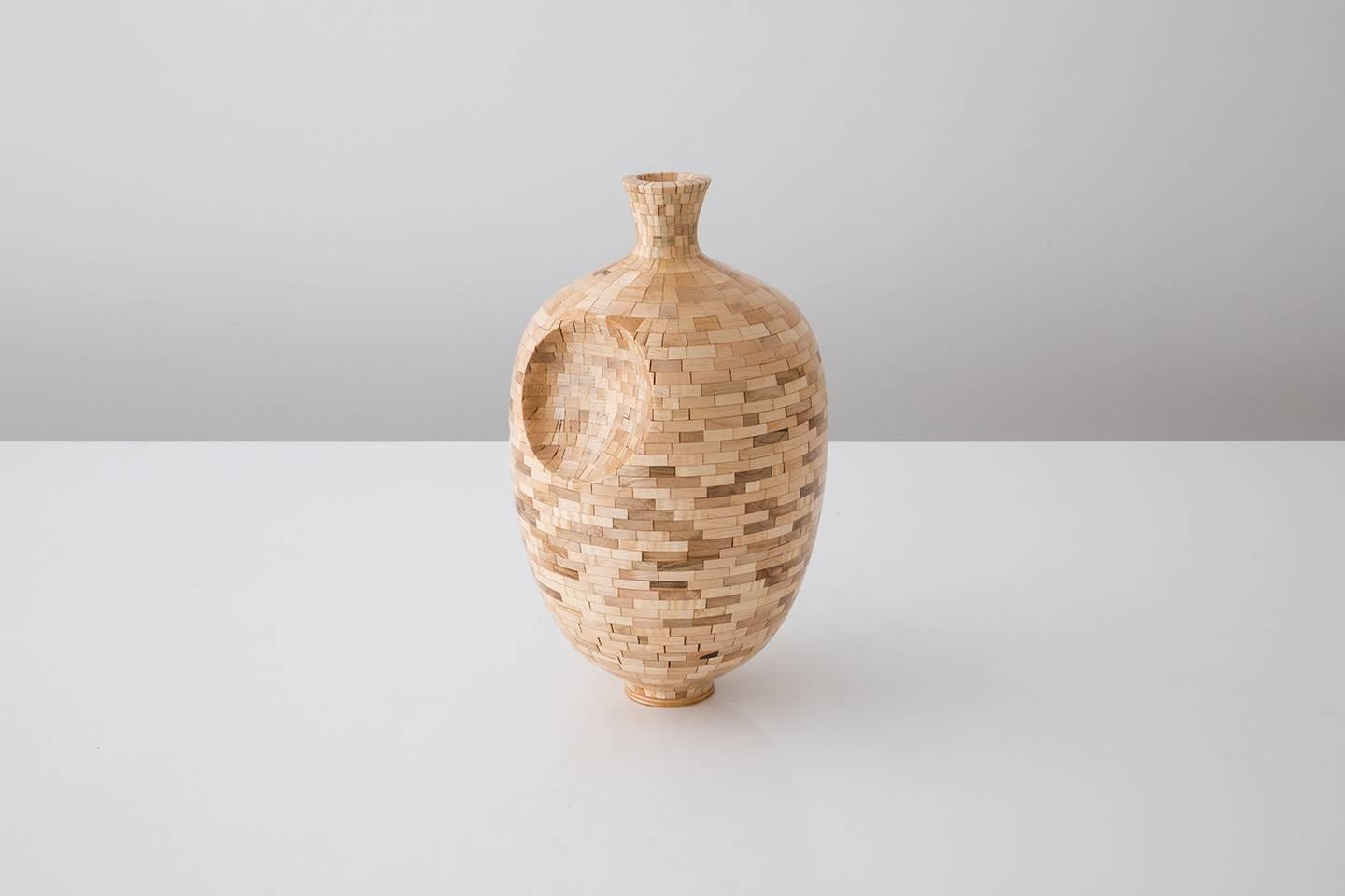 Part of Richard Haining's Stacked Collection, this vase was made using reclaimed maple. The wood was salvaged from a variety of local Brooklyn wood shops. The woods natural coloring shows off tones ranging from ivory and pale yellow to some mid and