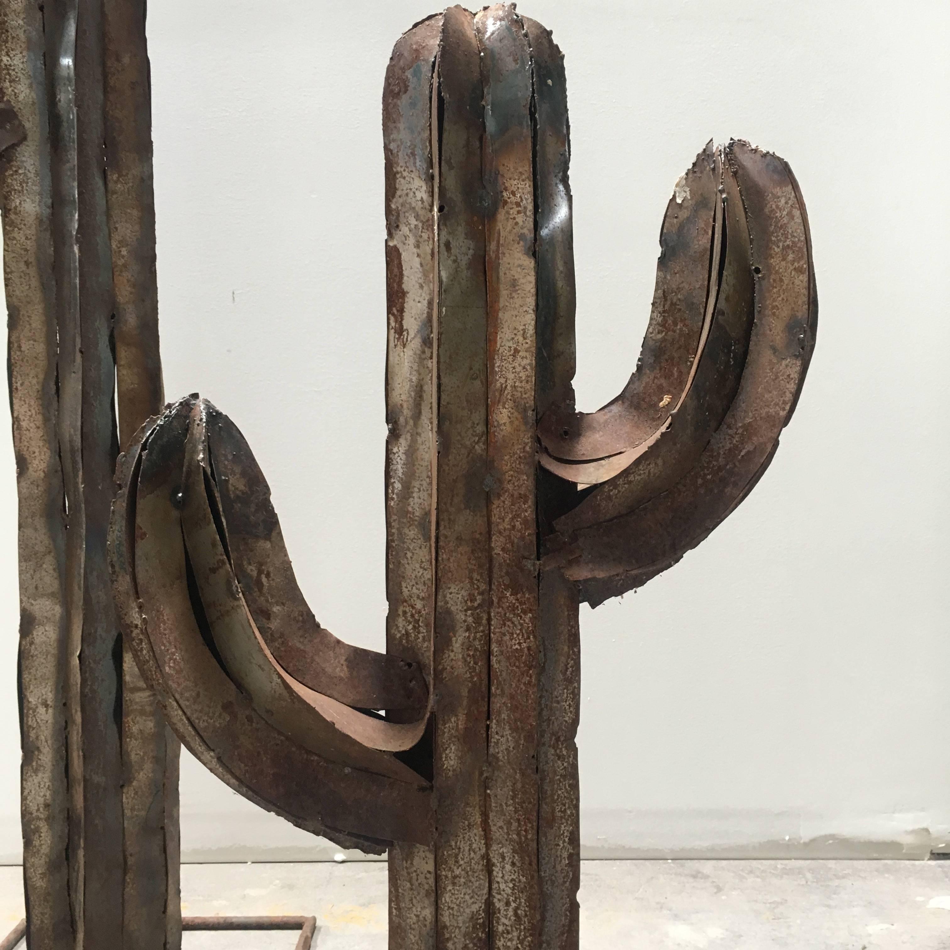 Vintage cactus sculpture, the metal aged, red-ish, and rusted to perfection with loads of Southwest / desert charm. (Larger + Small cactus sculpture unavailable)  

Measure: Medium 57" H x 22" W x 12" D