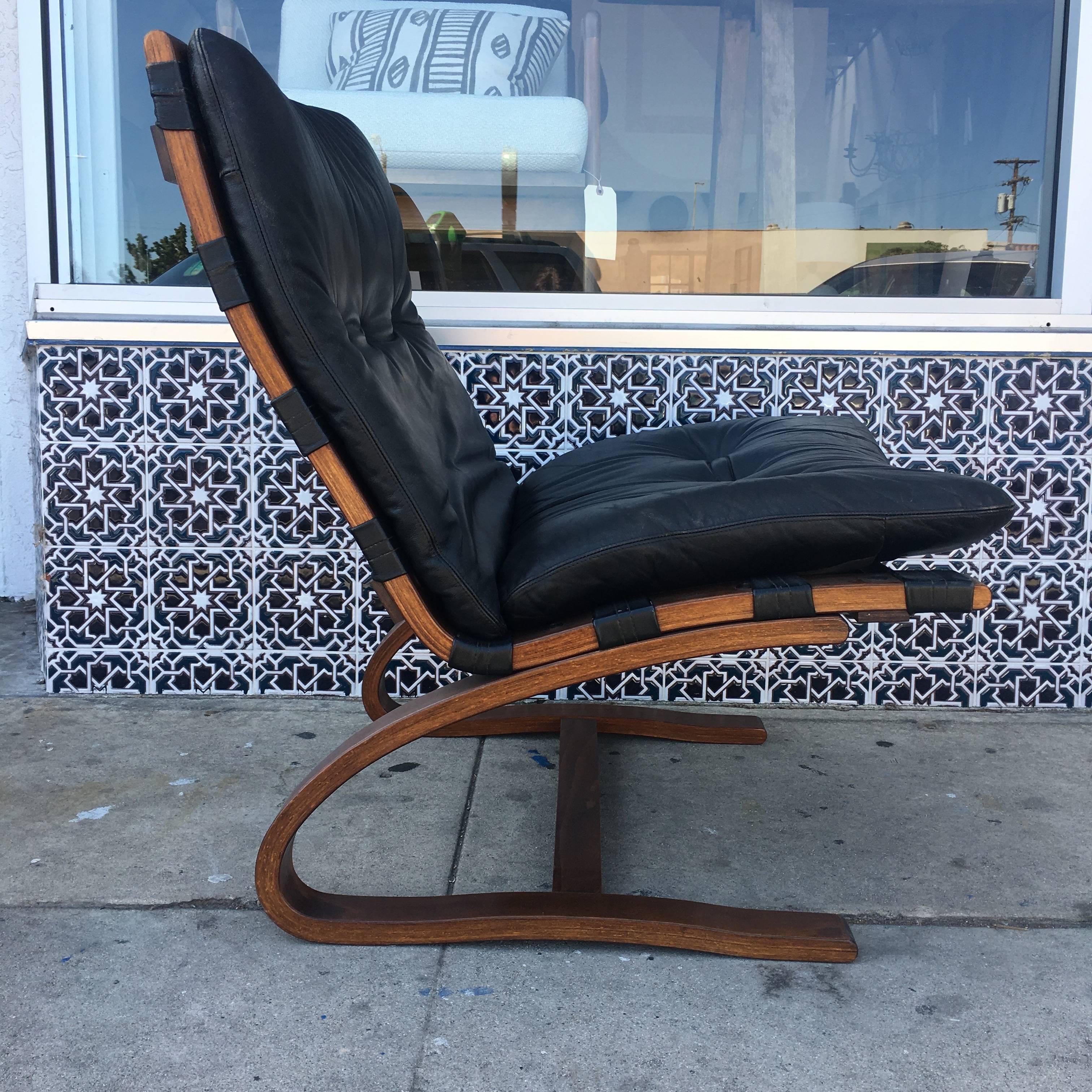 Swedish Pair of Black Danish Leather Lounge Chairs