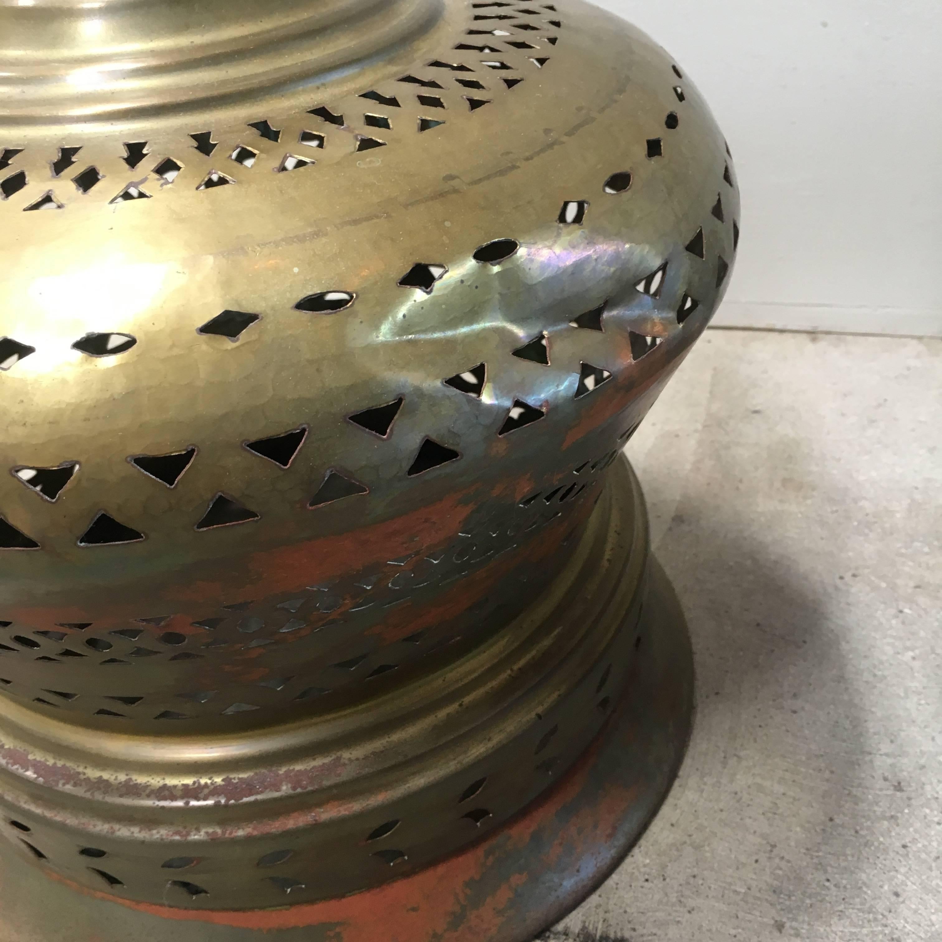 Vintage Moroccan brazier, an item used for cooking tagine. Sculptural brass has intricately decorated with stamped designs, with a ornamental finial. Interior dish is copper.