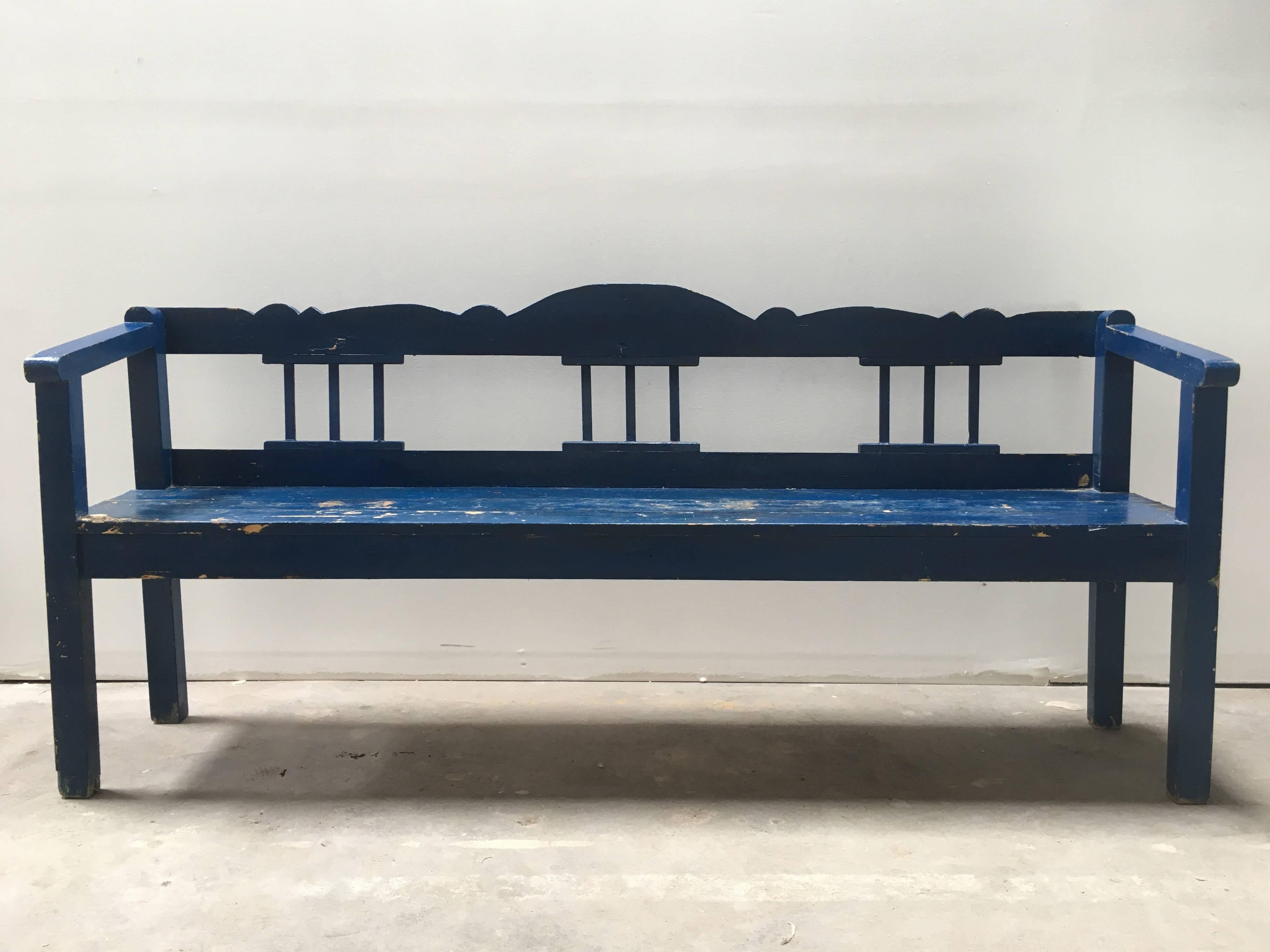 Painted a vibrant blue and worn to rustic perfection, this 19th century European farm bench is perfect for gardens, banquet dining, indoor or outdoor.