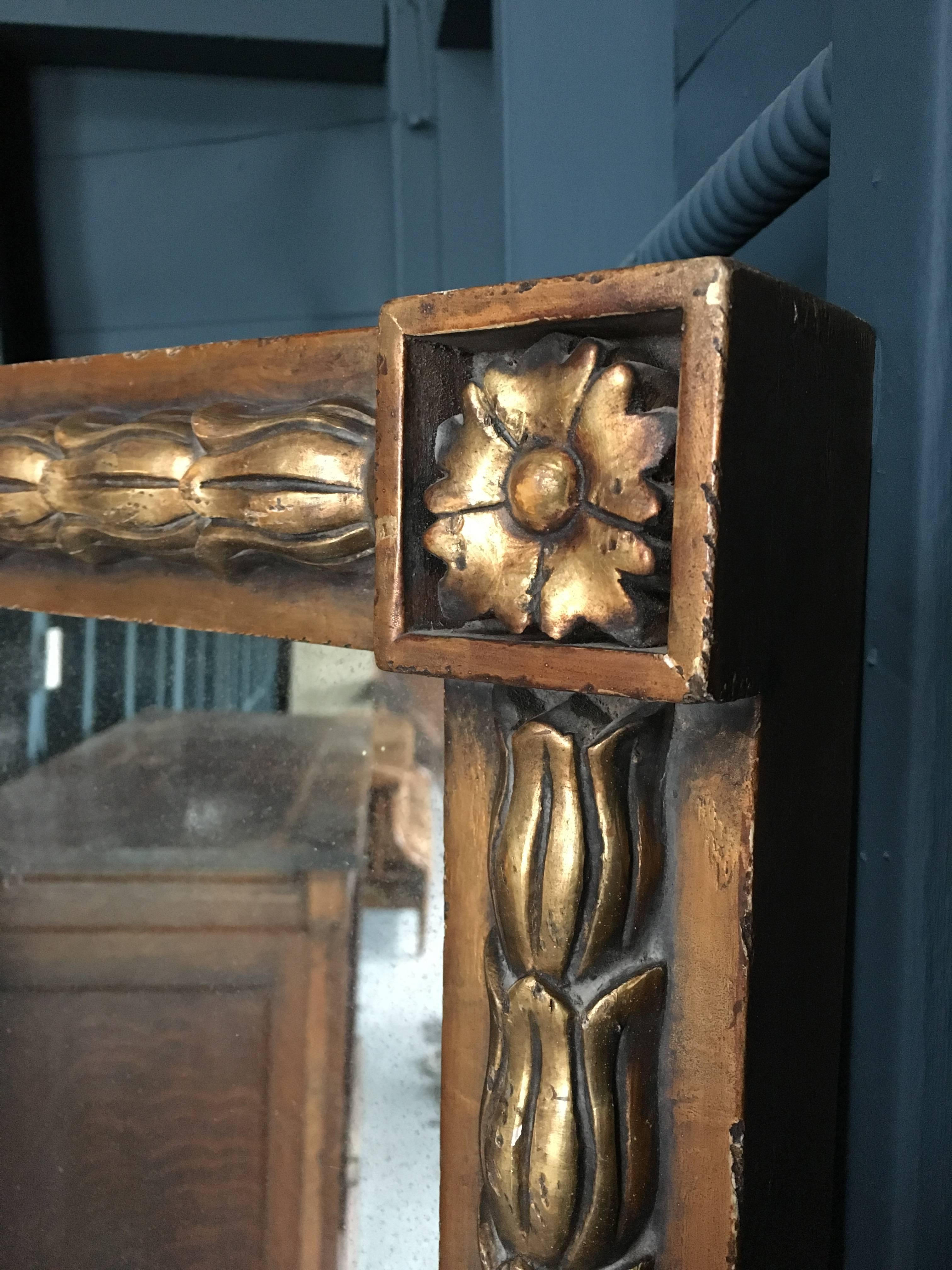 Large antique mirror with mitered panes and brass details. Very heavy and solid with hanger attached.