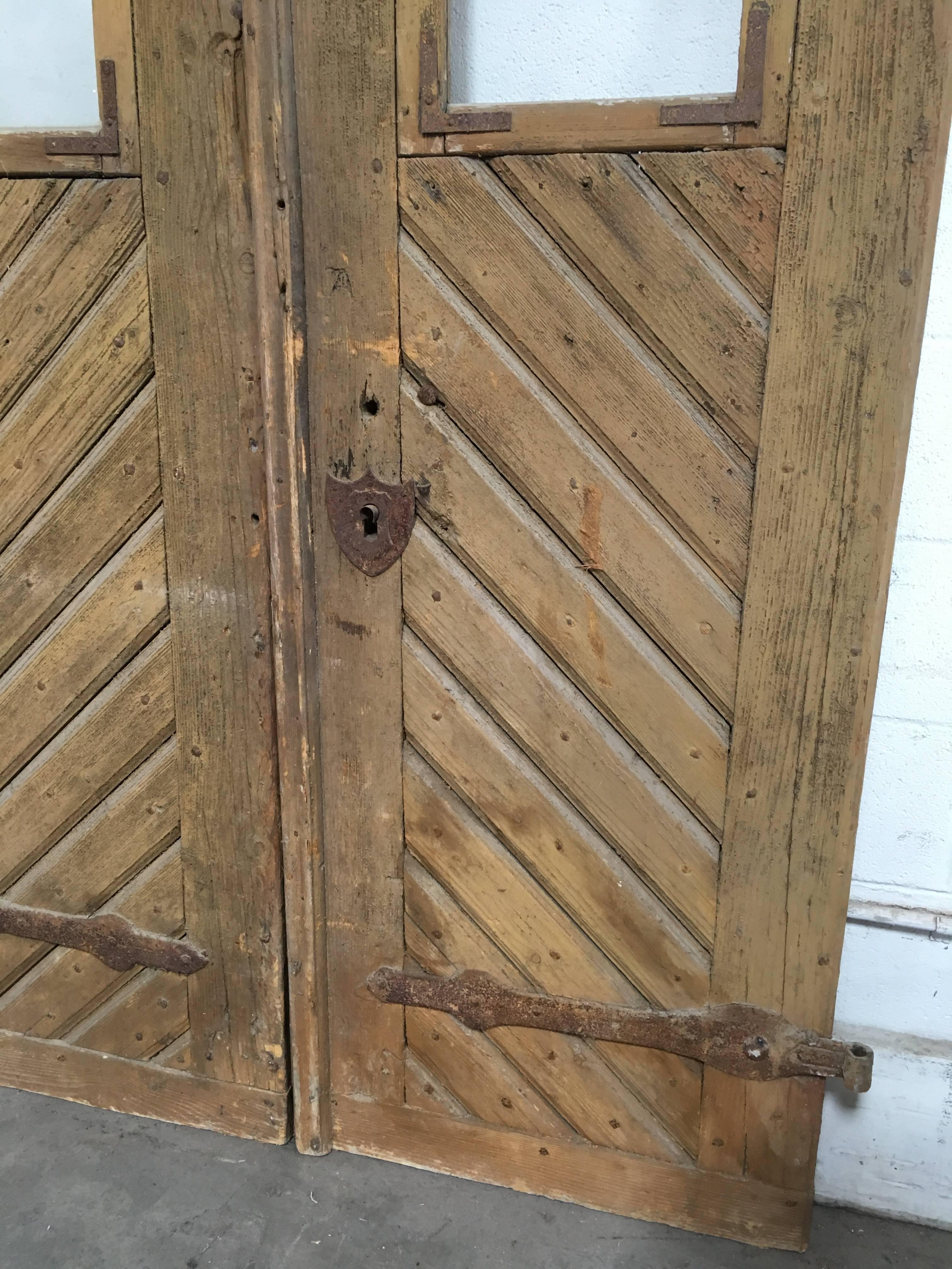 Beautiful wooden doors with iron hardware, wonderfully preserved. No key, but all working latches and parts.

Measurement listed is for both doors latched together, left door 24