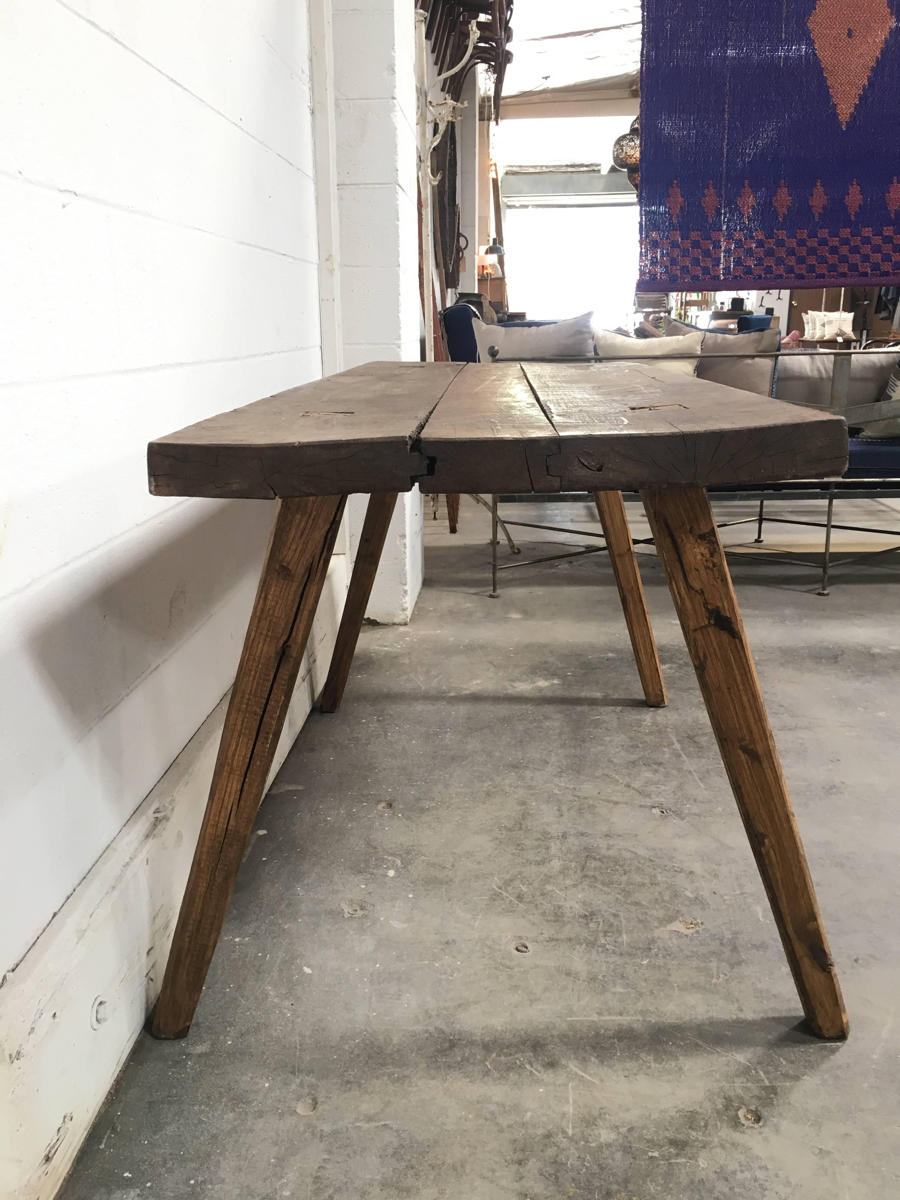 Wooden butcher block table sourced from France, very sturdy but a subtle wobble. Great for an entry console table, work desk, or kitchen island.

Width of legs at bottom is wider: making it 34