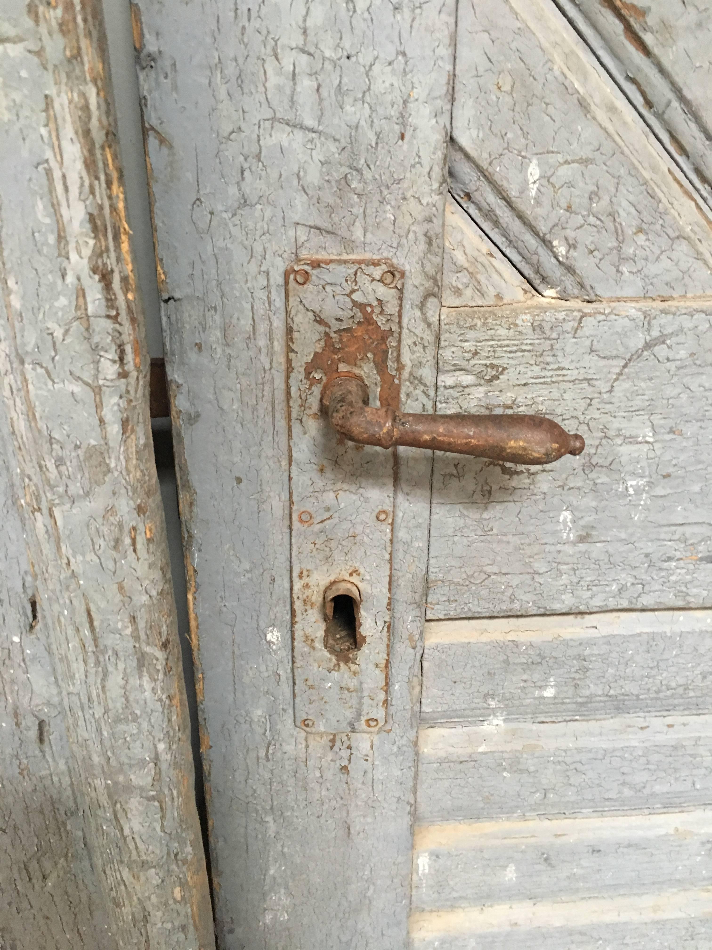 Wooden doors sourced from a farm in France, some wear in back corners.

Wonderful when mounted on a barn track as sliding doors.