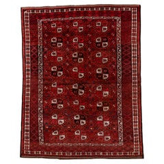 Vintage Afghan Rug with Deep Red Field and Repeating Gul Motifs