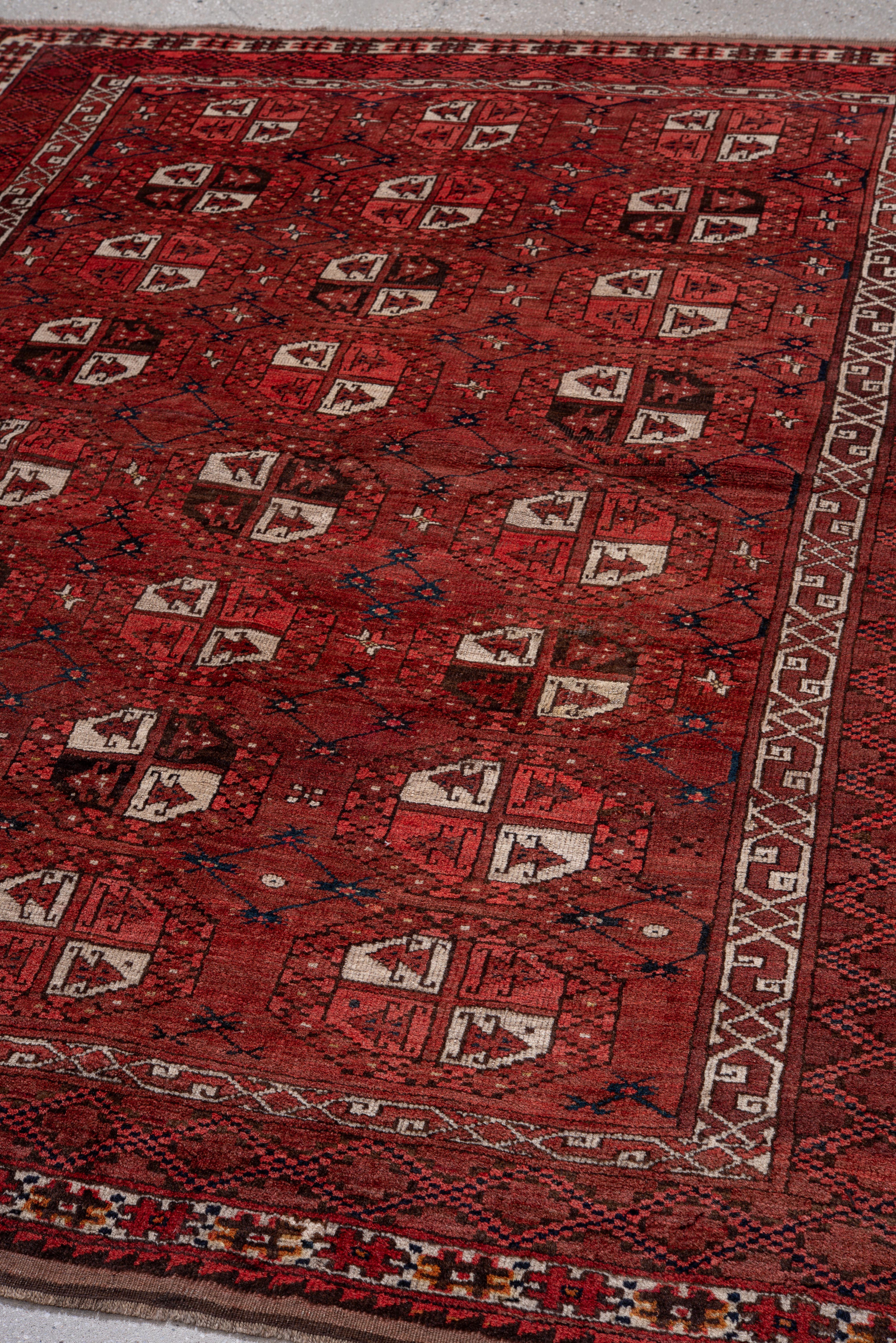 Vintage Afghan Rug with Deep Red Field and Repeating Gul Motifs For Sale 1