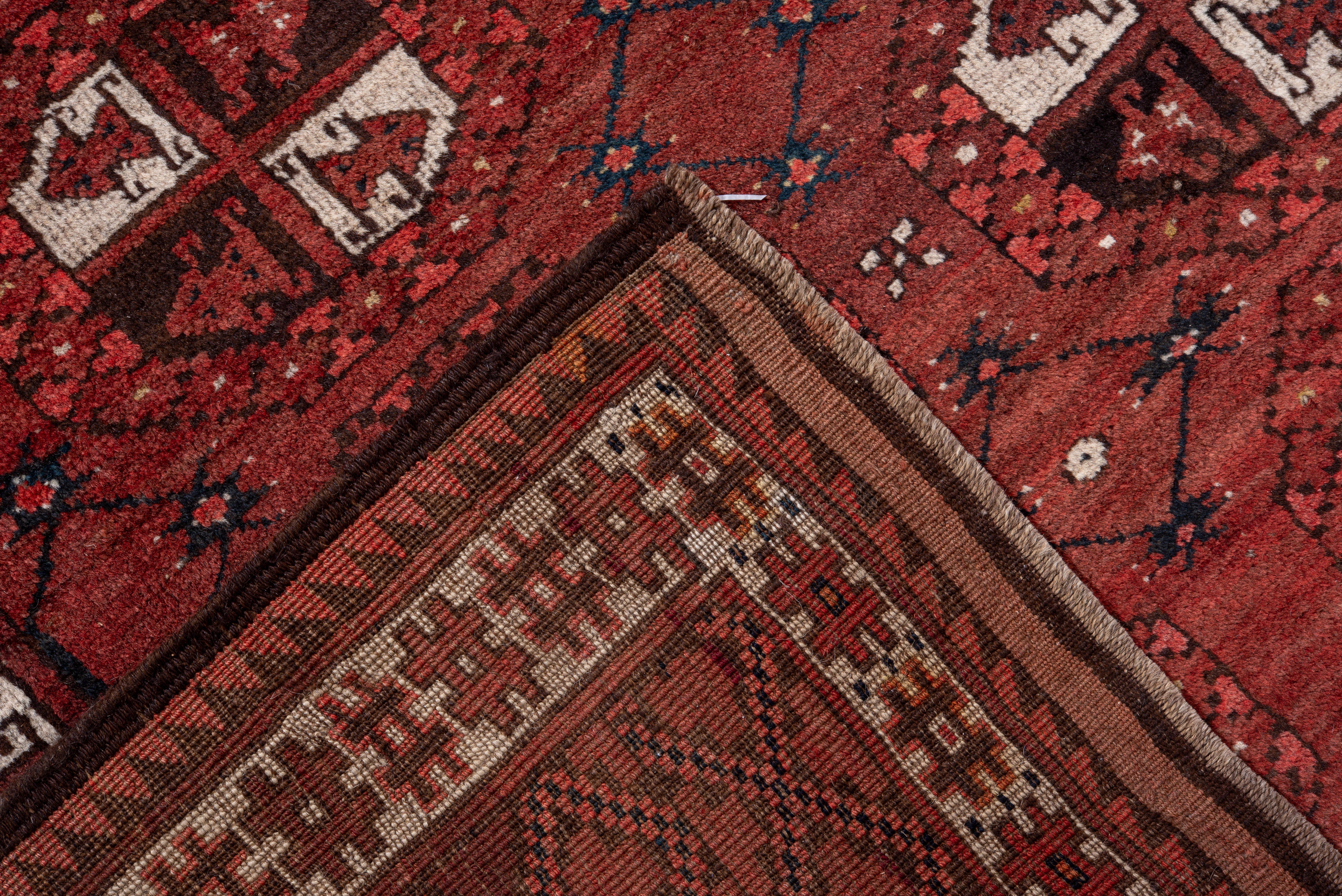 Vintage Afghan Rug with Deep Red Field and Repeating Gul Motifs In Good Condition For Sale In New York, NY