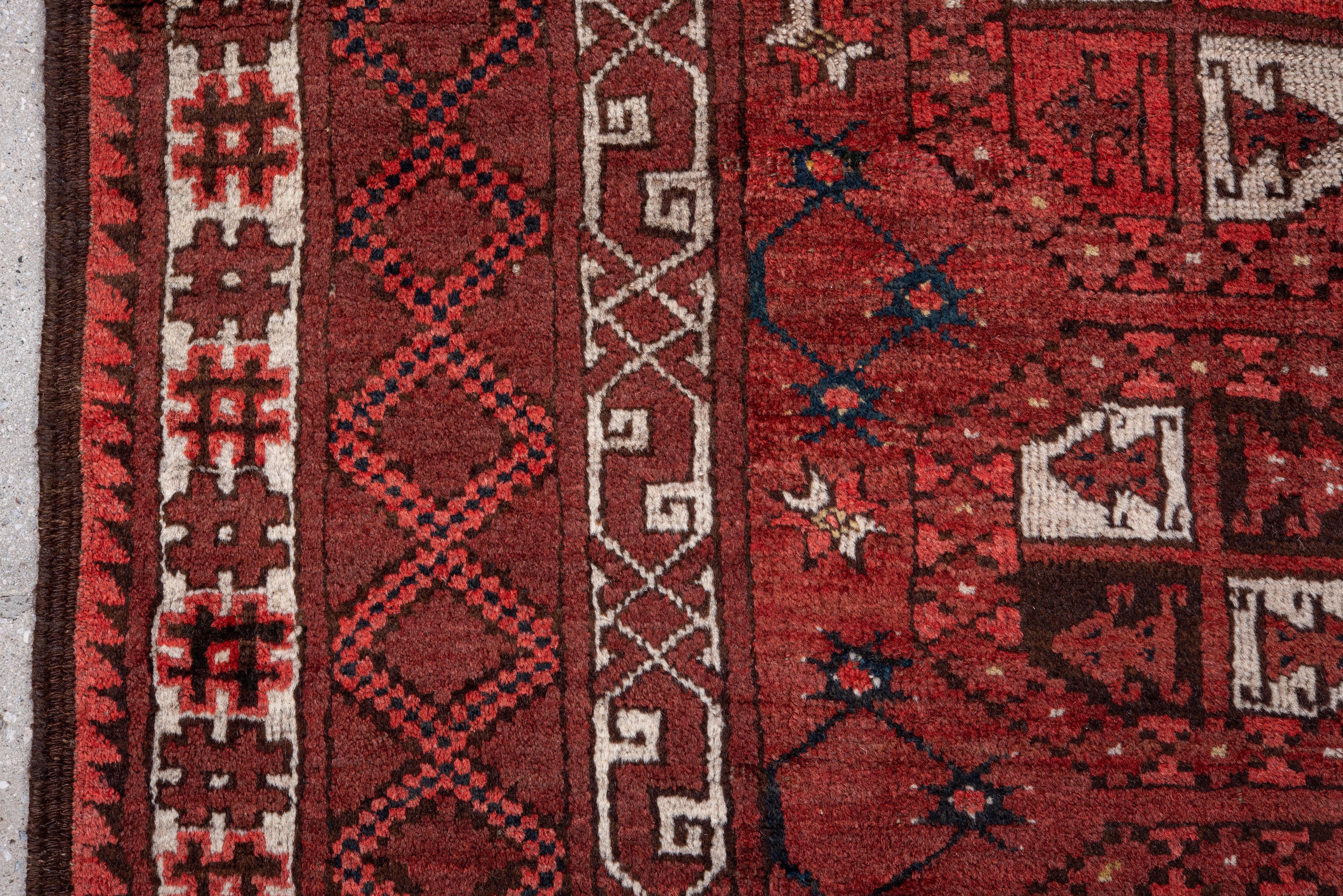 20th Century Vintage Afghan Rug with Deep Red Field and Repeating Gul Motifs For Sale