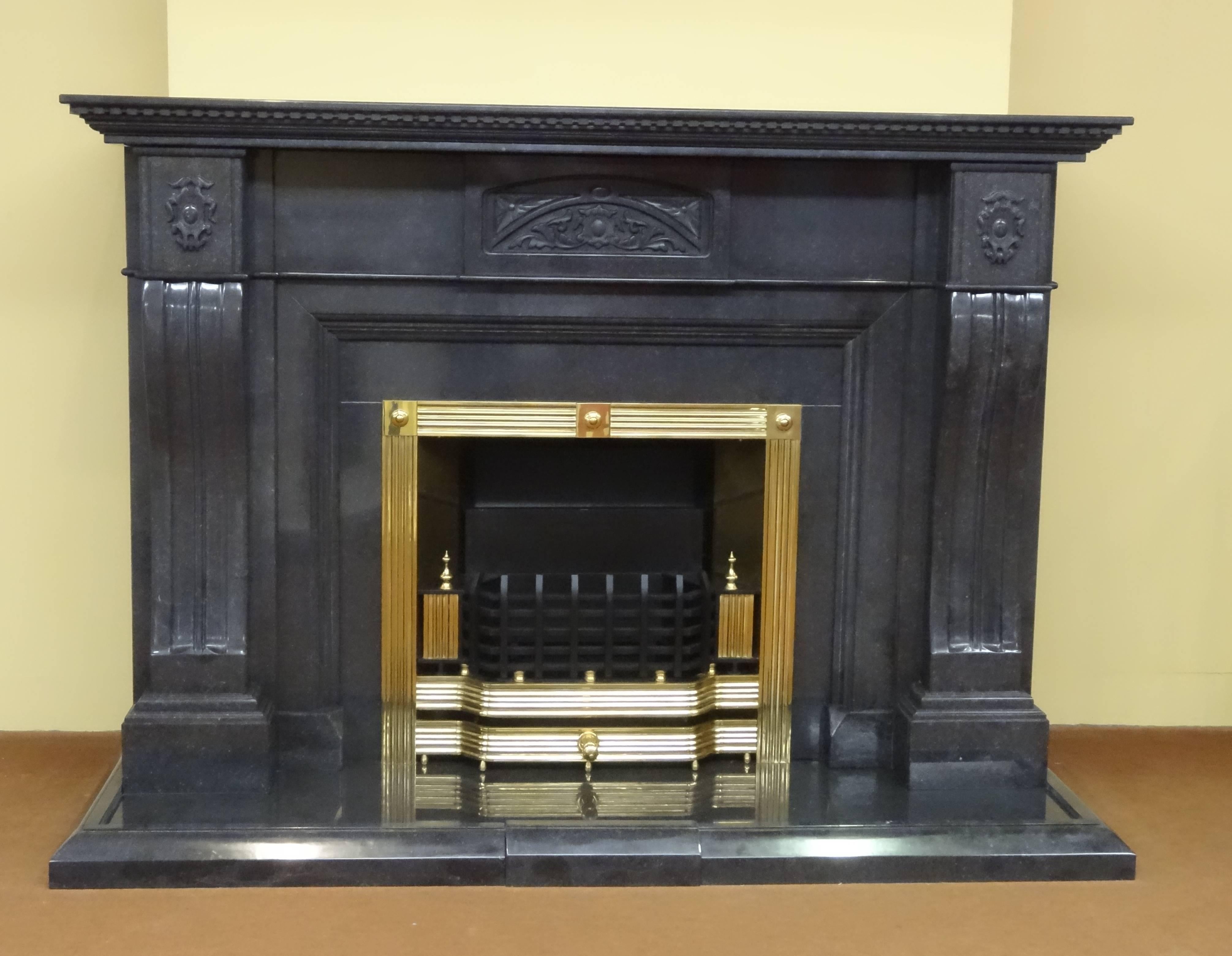 We created this fireplace in polished Kilkenny Black Marble, this is a fossilized marble native to Ireland. The fireplace incorporates a register grate created in 0.5 inch solid brass; a matching marble hearth with marble fender as
