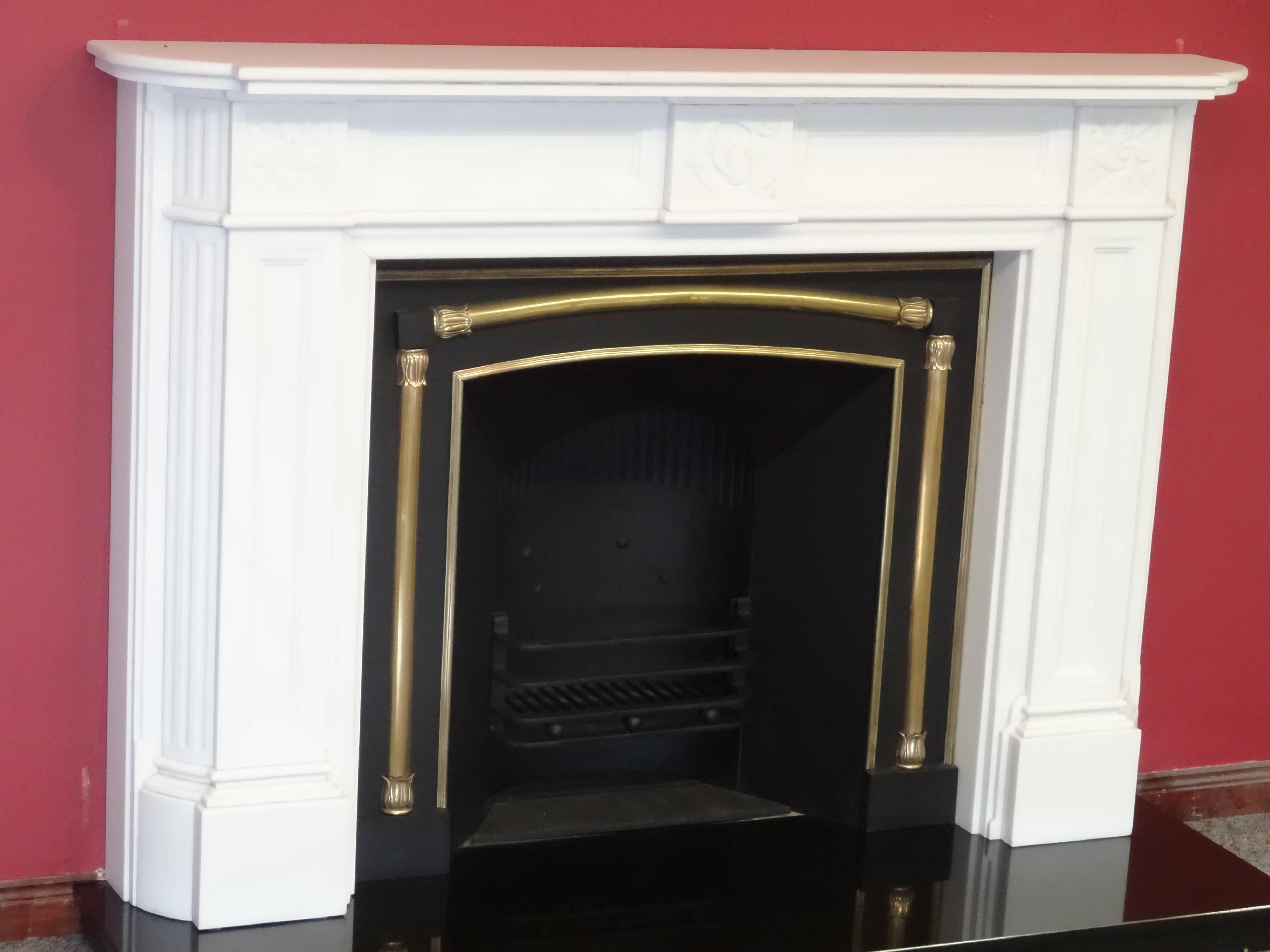 1930s reproduction of Victorian fire surround in pure white marble, with antique Victorian cast iron and brass fireplace grate. Fireplace does not include the hearth.
 
