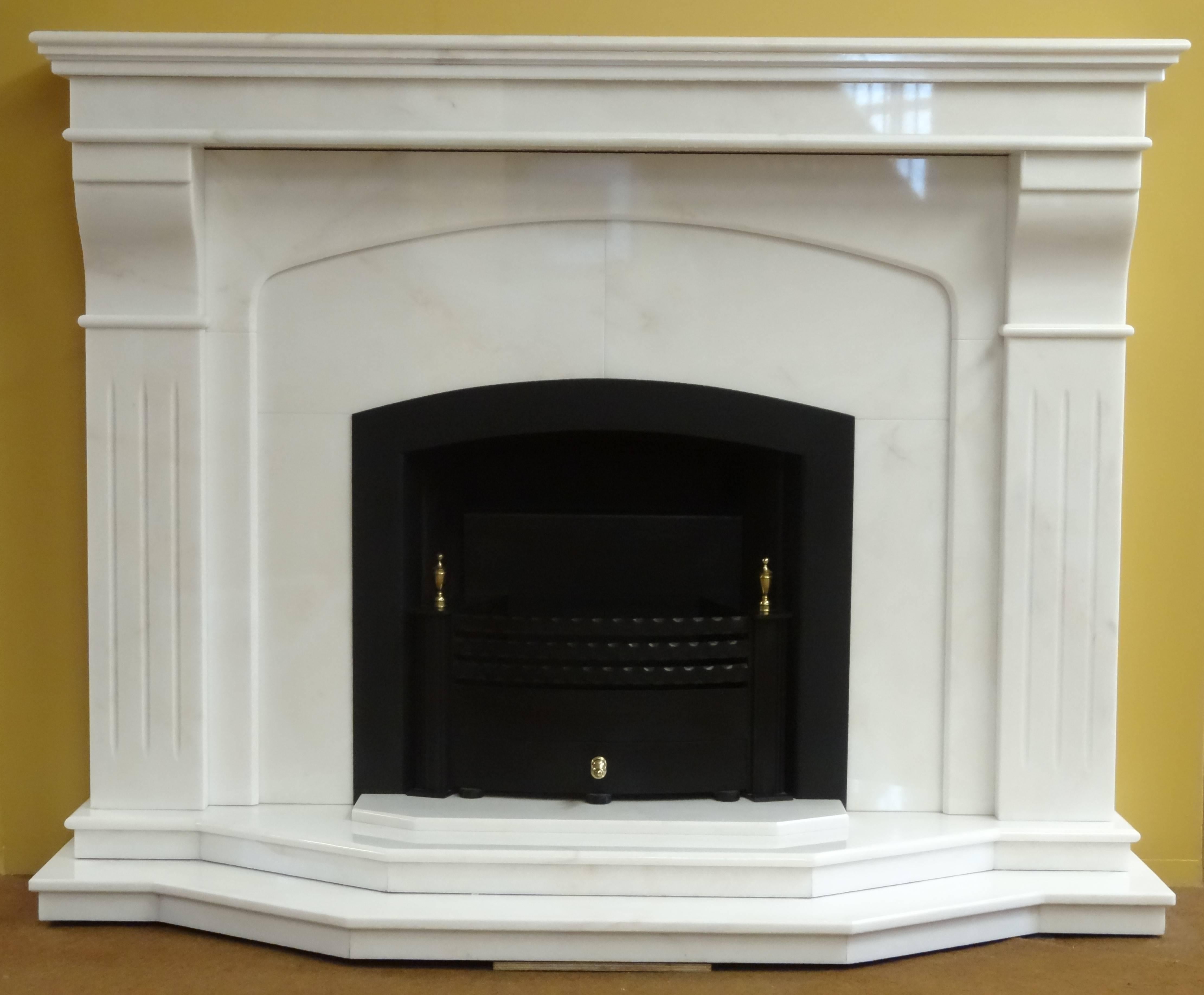 We created this contemporary fireplace from polished Estrimoz marble. The fireplace comprises of matching marble hearth, metal frame built in to the marble insert and removable metal and brass fire basket.

Measurements:
Mantel 66 inches x 11