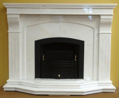 21st Century Contemporary Carved Marble Fireplace with Metal Trim and Fire Grate