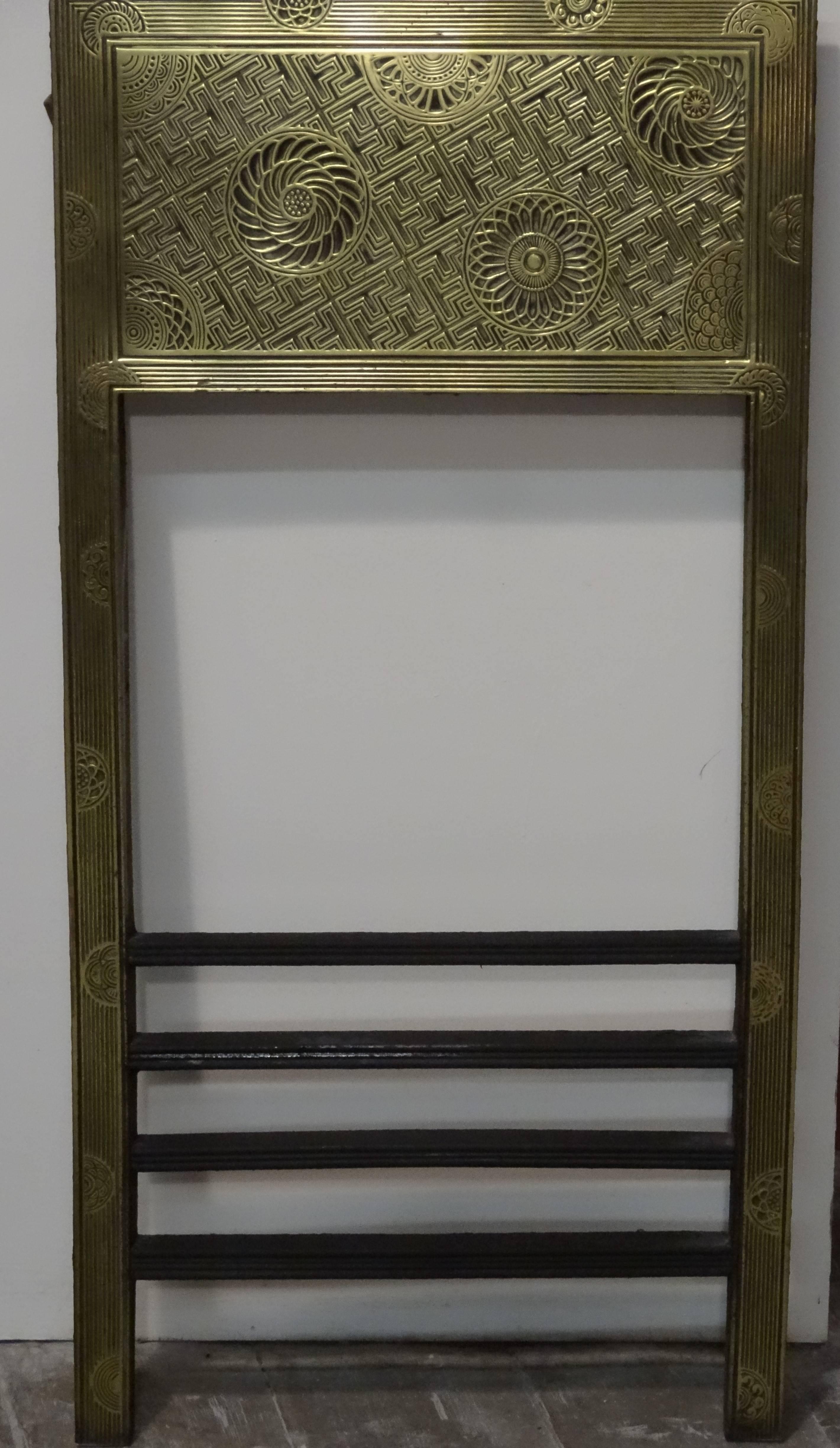 Antique 19th century brass and iron fire surround insert produced by the Barnard Bishop and Barnard foundry and designed by Thomas Jeckyll.
This cast iron and brass fire surround insert has Japanese inspired aesthetic designs of flowers and a