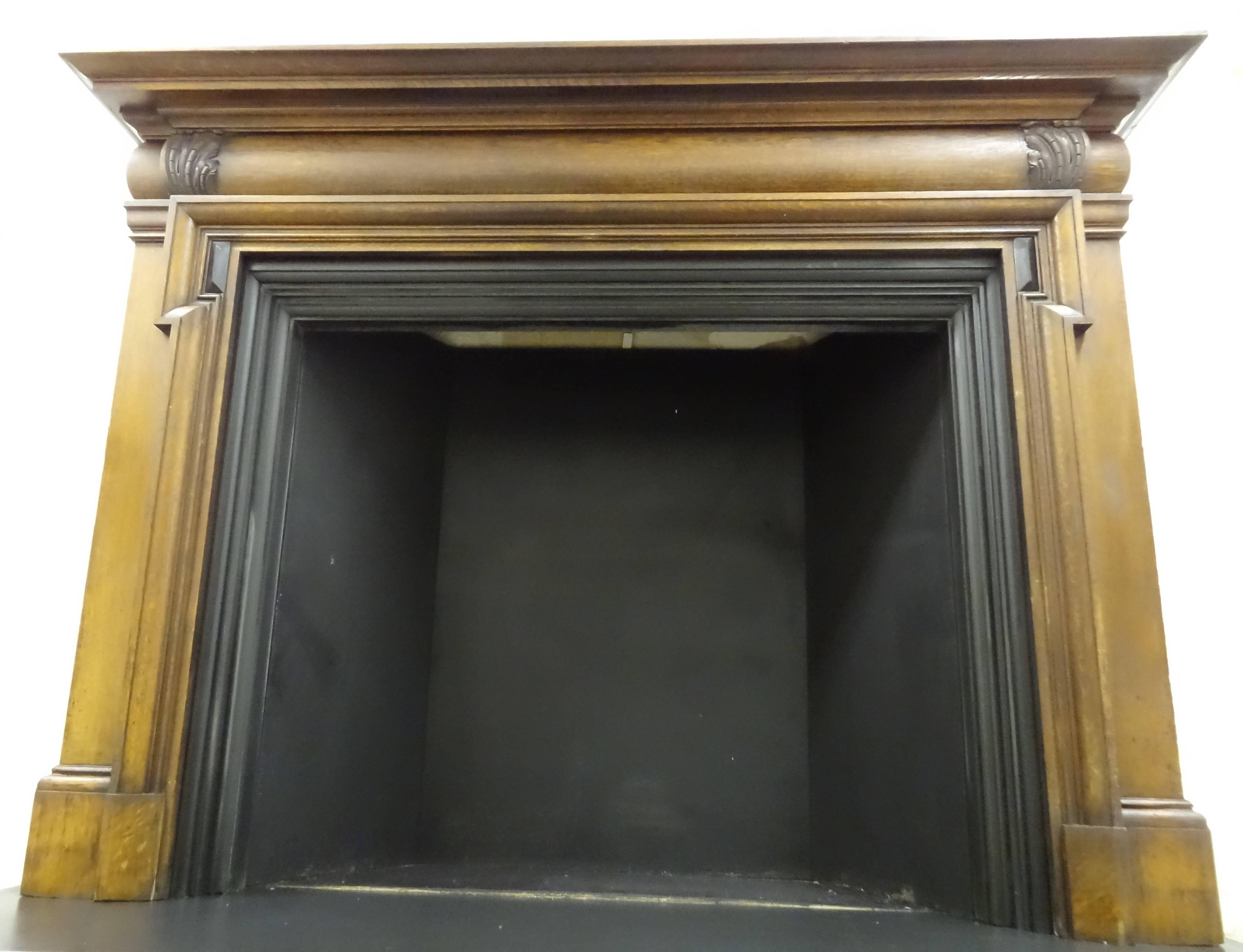 Reclaimed antique Victorian carved oak bolection fire surround with contrasting dark ebony feature. Brass plate with switch fitted to right hand gable and brass fitting for electric wiring fitted to top of mantel. Slate hearth and trim priced