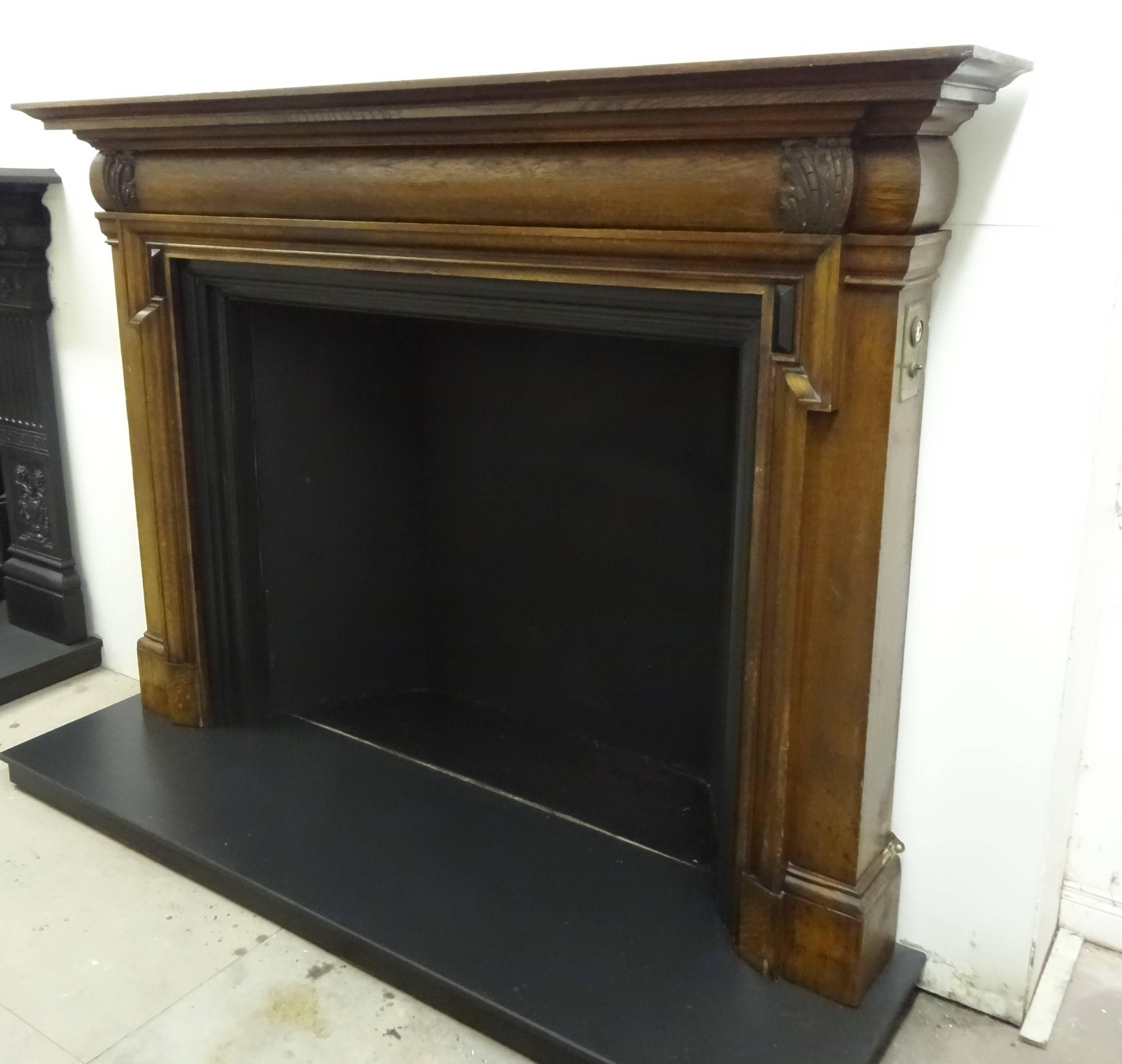 Northern Irish 19th Century Victorian Carved Oak and Ebony Bolection Fire Surround For Sale