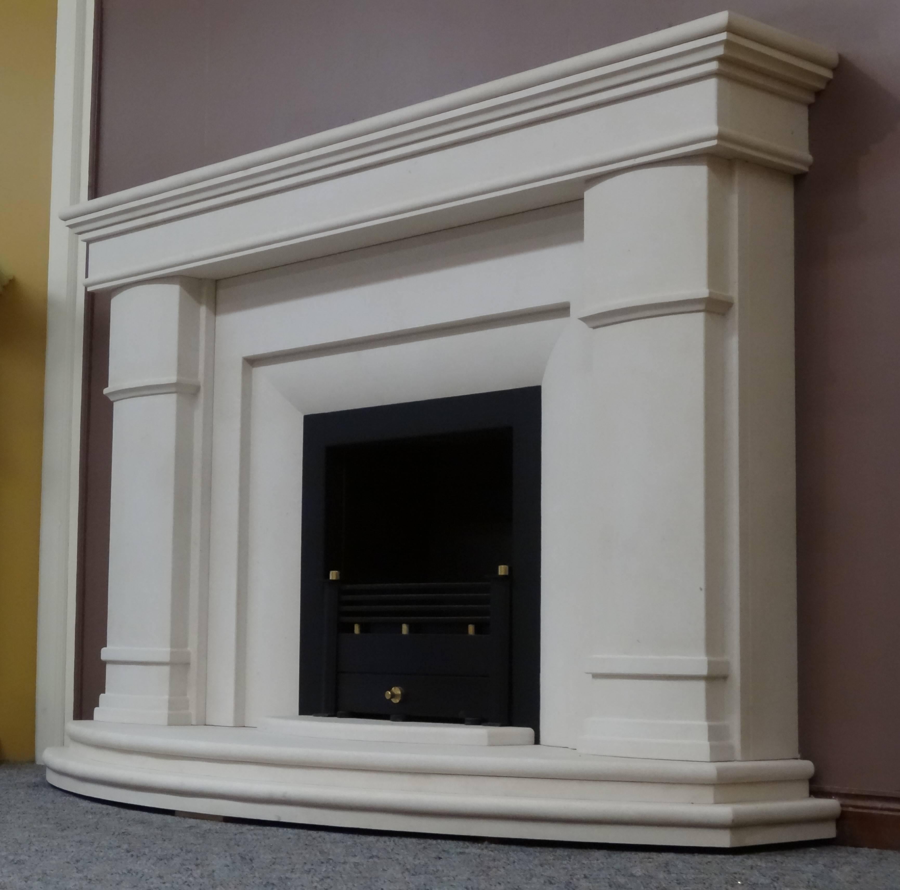 Carved 21st Century Irish Contemporary Limestone Fireplace Black Trim and Fire Basket For Sale