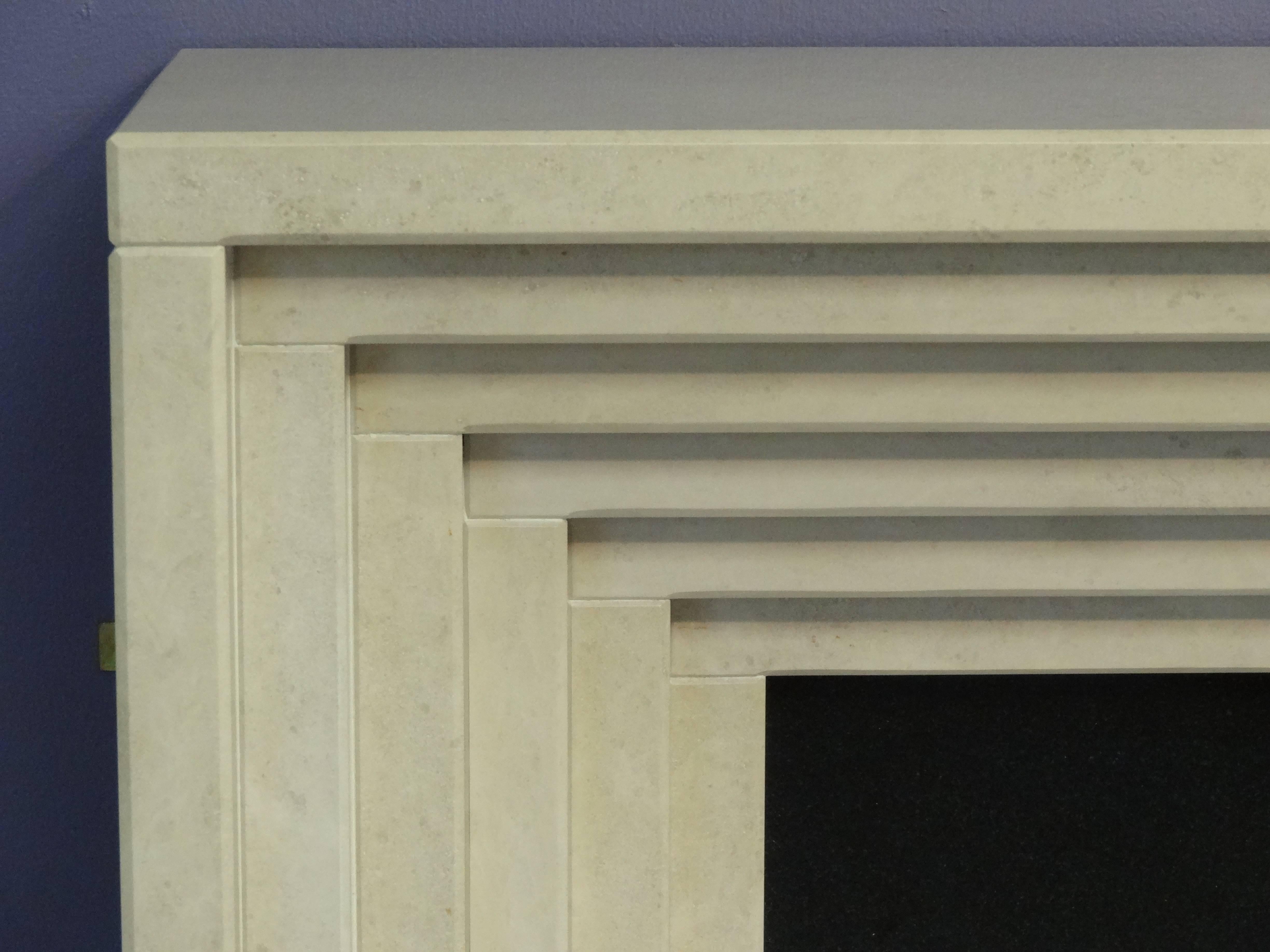 Contemporary Irish Art Deco Style Marble and Granite Fireplace with Steel Trim & Fire Basket For Sale