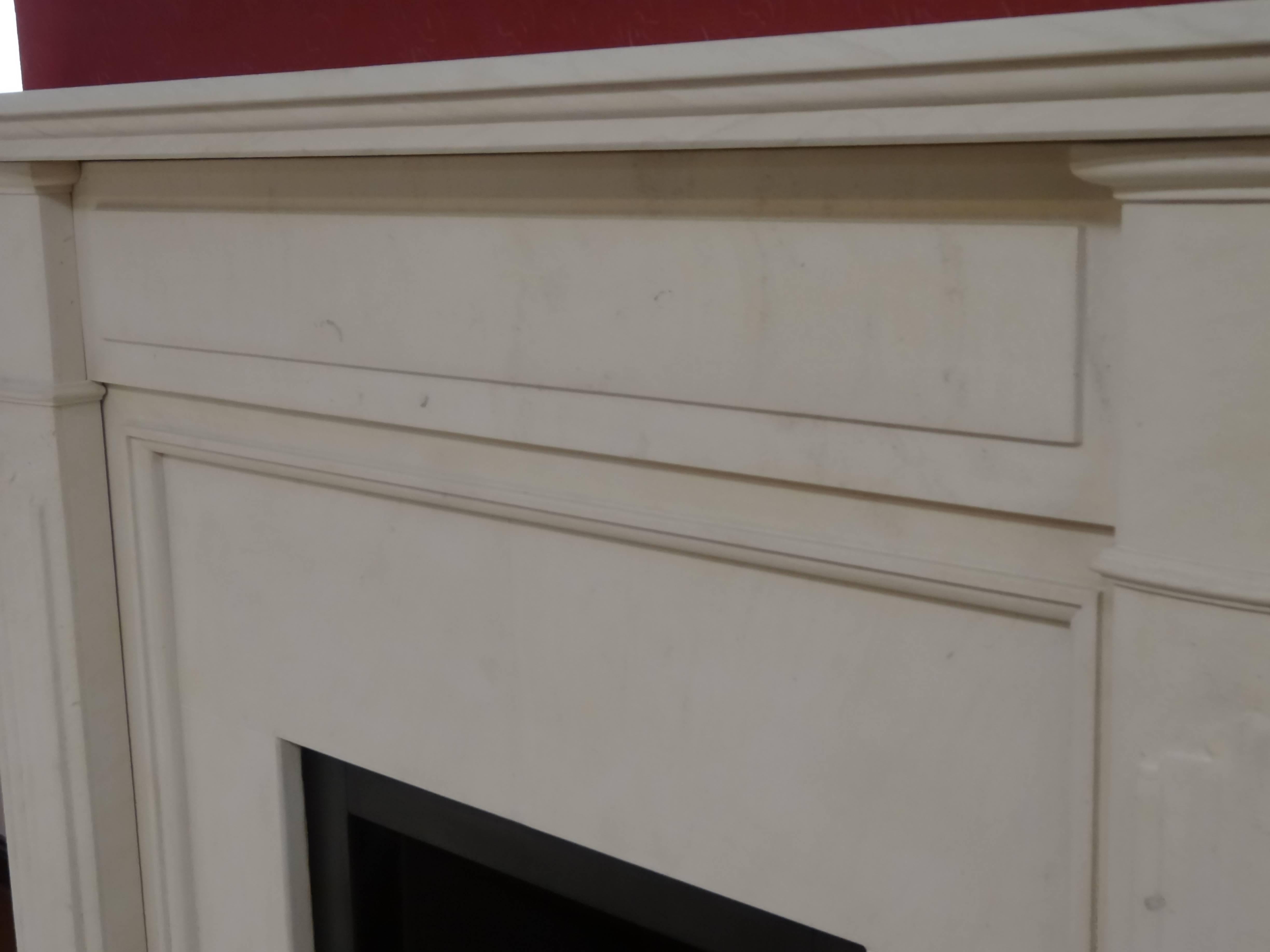 Contemporary 21st Century Irish Carved Limestone Fireplace Metal Trim and Fire Basket For Sale