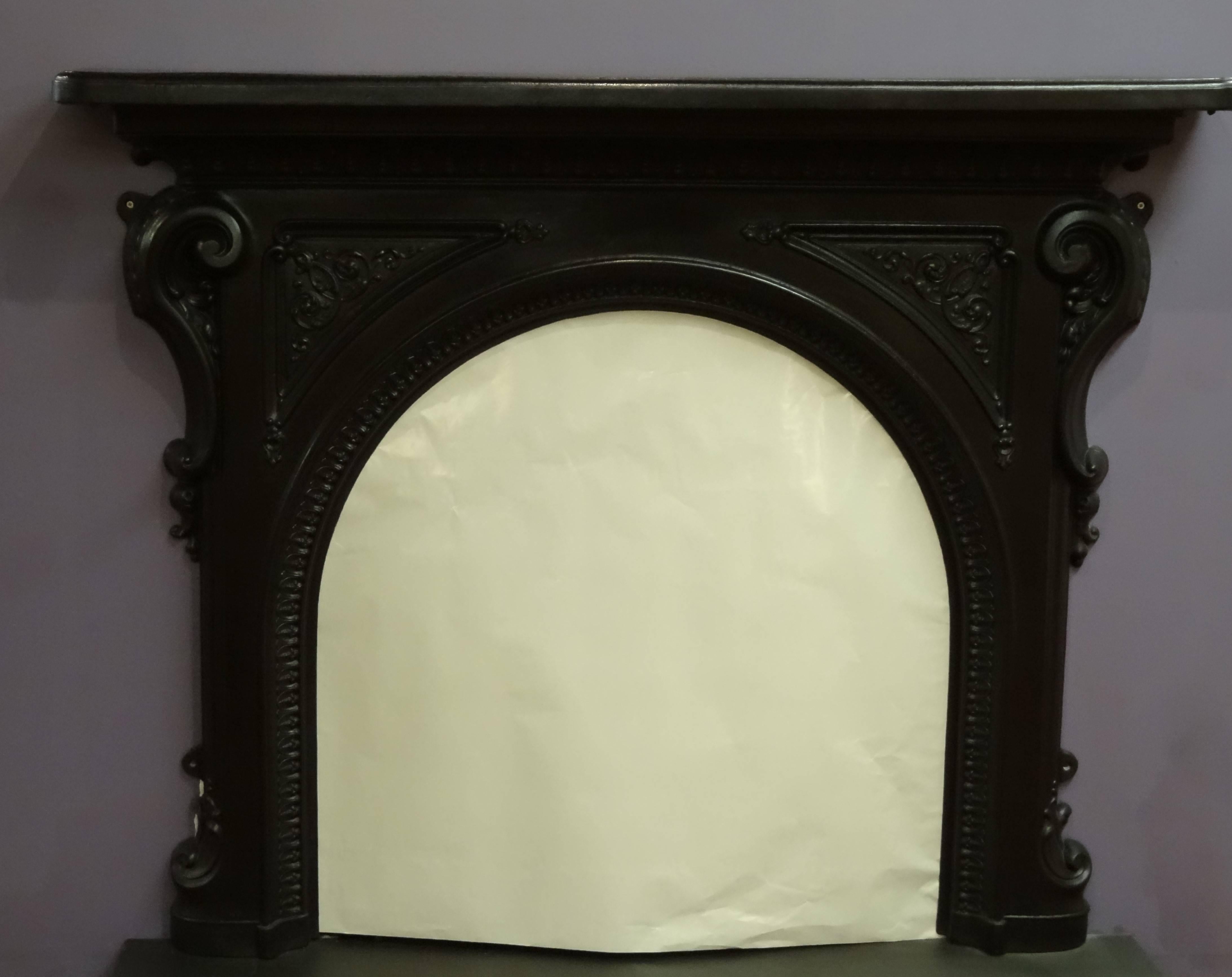 Victorian Arched cast iron fireplace surround featuring S scroll side corbels, decorative leaf detail on the arch and under the mantel. Cast Iron Insert priced separately.

External measurements:
Overall width 60.5 inches / 154 cm
Overall height