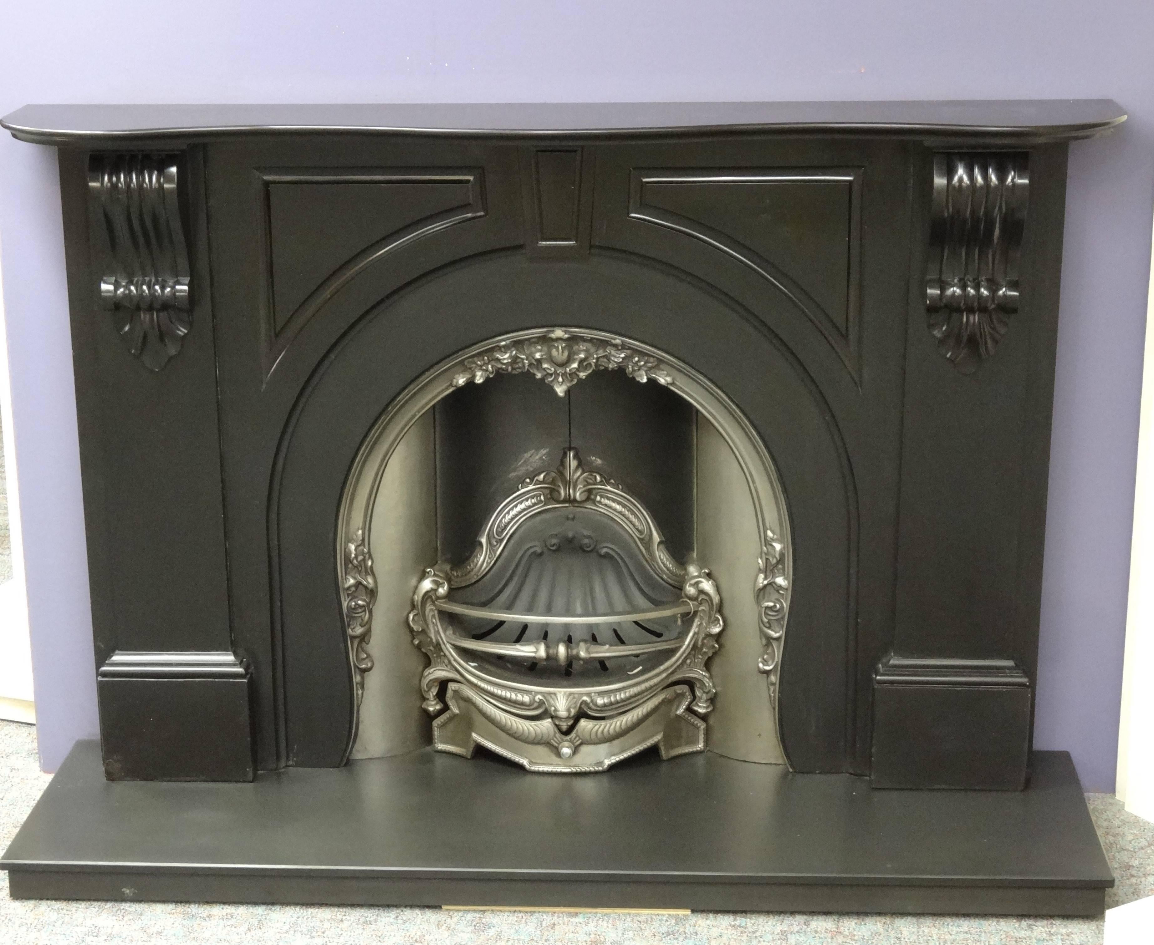 Reclaimed Victorian glazed black marble fireplace surround. The fireplace an arched aperture, fluted corbels and panels, center keystone, serpentine mantel.

External Measurements:
Mantel width 72.75 inches / 184.7 cm
Mantel depth 13 inches / 33