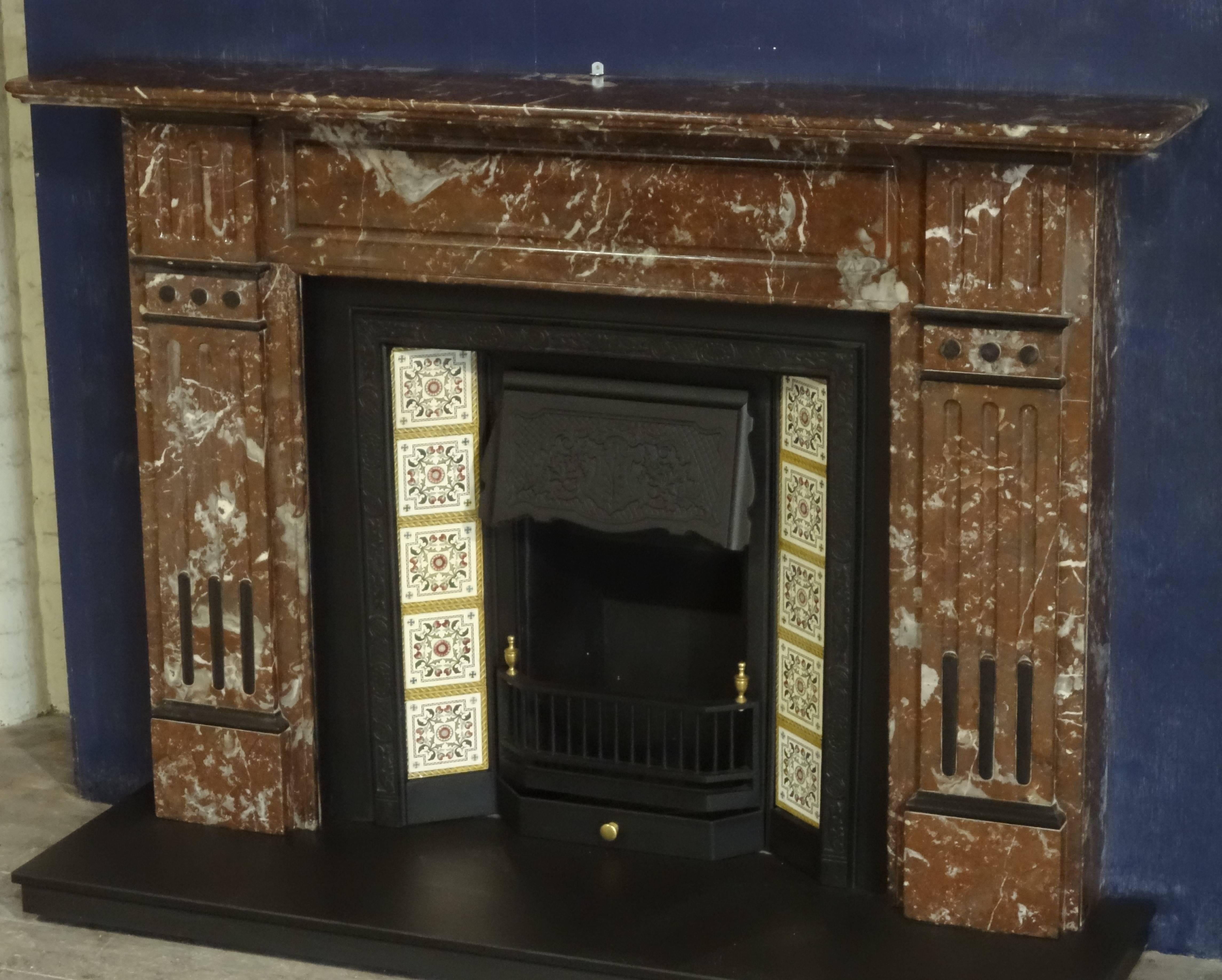 19th century antique Victorian carved breccia marble fireplace surround with polished slate mouldings. Reclaimed from a Victorian property in County Antrim Northern Ireland. Tiled cast iron insert and slate hearth priced separately.

Approximate