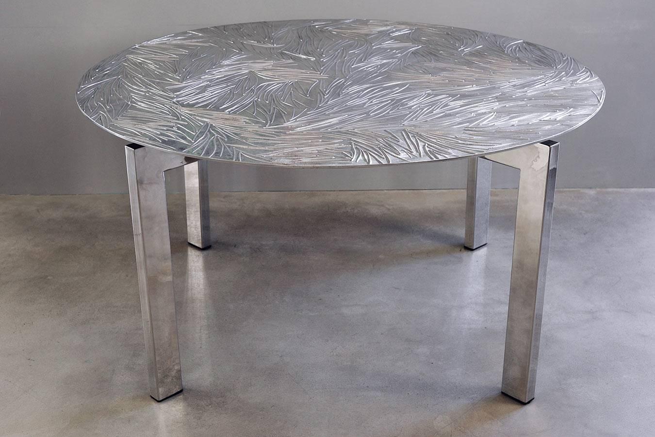 Limited Edition for the table with an aluminum cast top and mirror polished steel legs designed and made by the designer and sculptor Andrea Salvetti. 
A collection piece for artistic design lovers that conveys class and sophistication to the