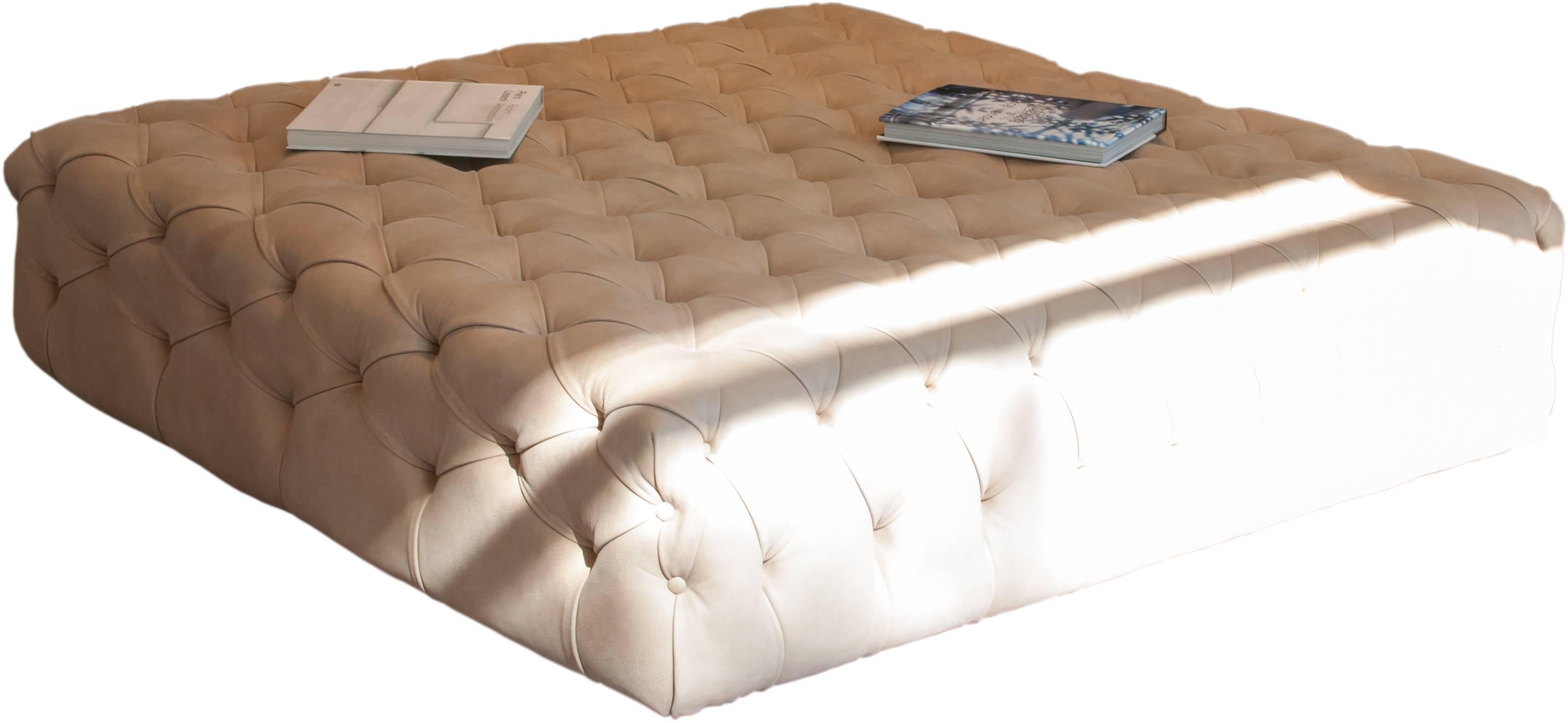 Wooden frame, padding in polyurethane foam. Non-removable covering in fabric or leather button tufting. Base in wood.