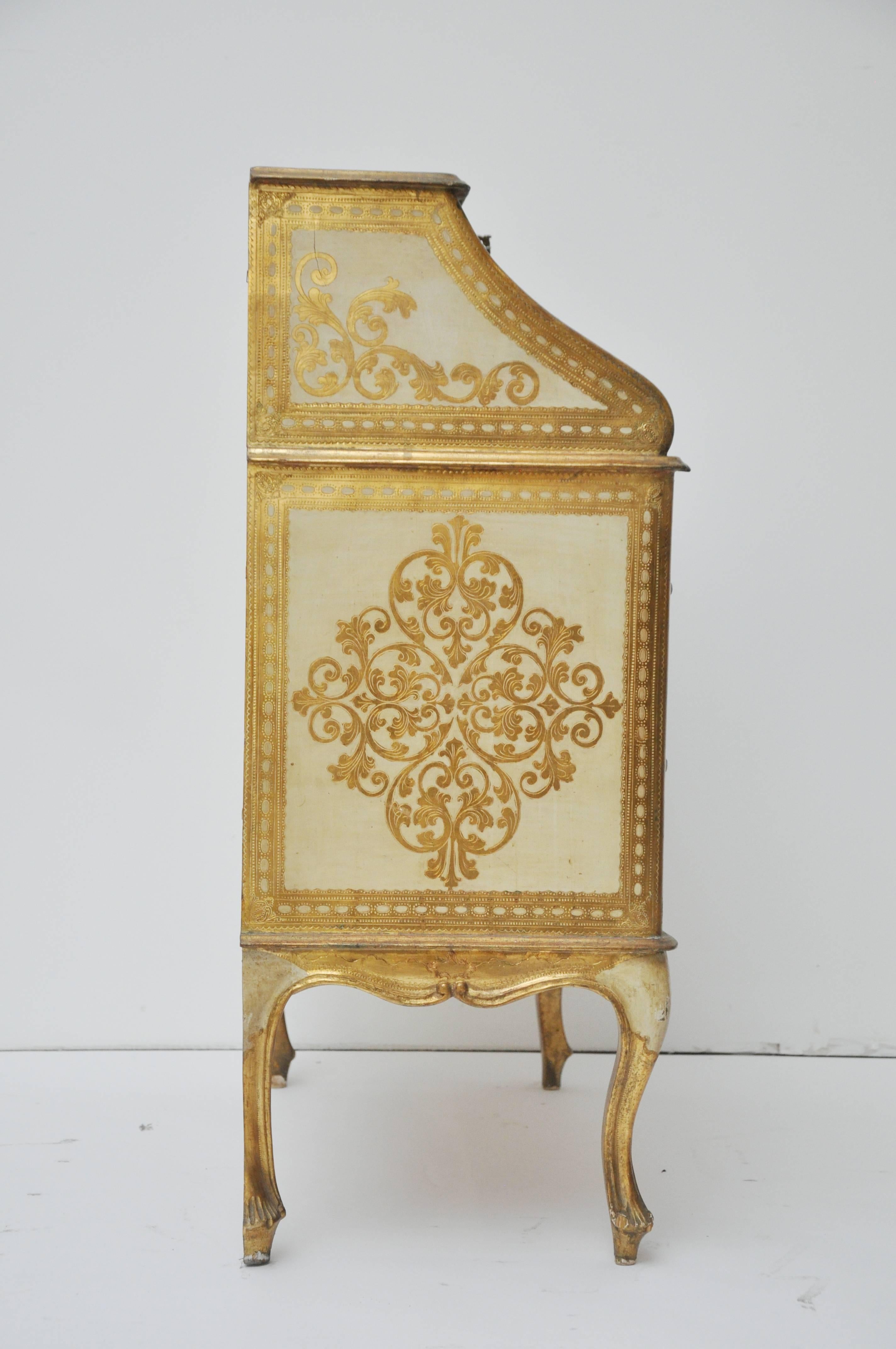 Diminutive hand-painted Italian desk with key and tassel. Beautiful gilded designs. Height to open desk top 30.38