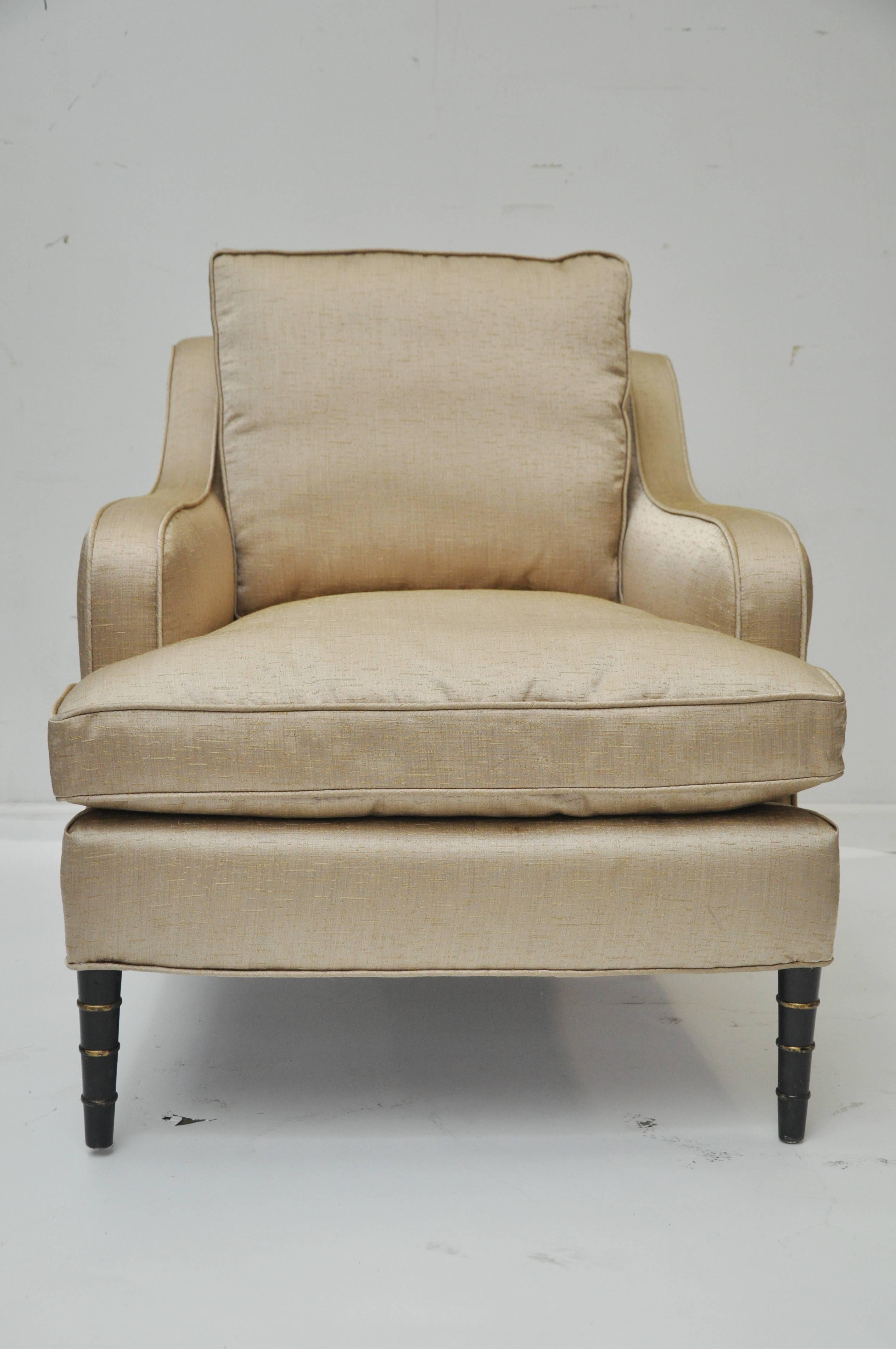 1920s curved armchair in new champagne colored silk upholstery. Cushion is down. Chair sits comfortably. Measures: Arm height is 22.75