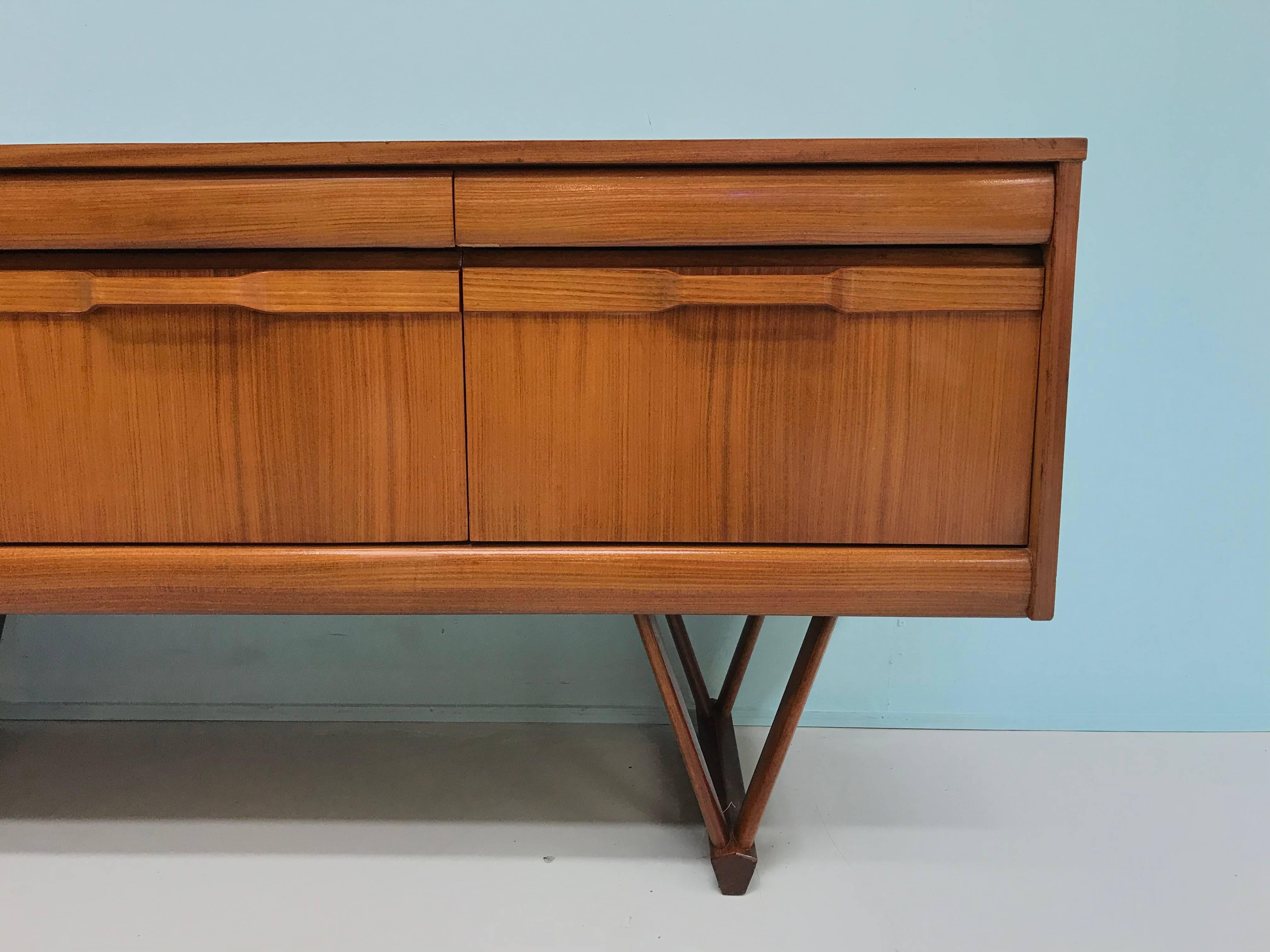Unique and rare teak sideboard with plywood handles and V-shaped legs. Designer / maker unknown.
Marked 16 may 1969 int the back.
Condition: very good.
 