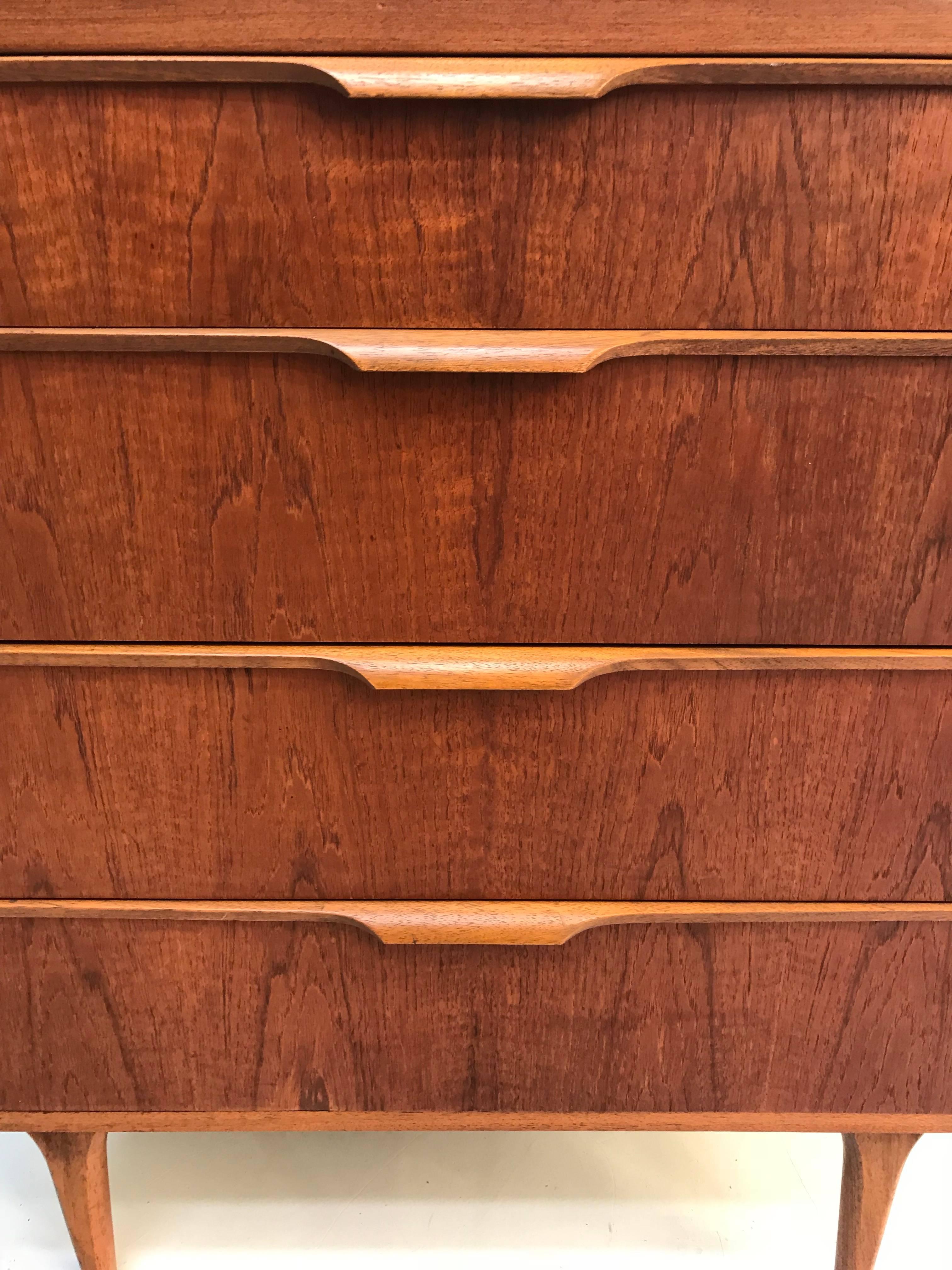 Stunning teak four-drawer enfilade by Austinsuite made in England design by Franck Guille in the sixties.
Condition: very good
Measurements:
76cm W/91.5 cm H/42 cm D

Itemnumber: 237.