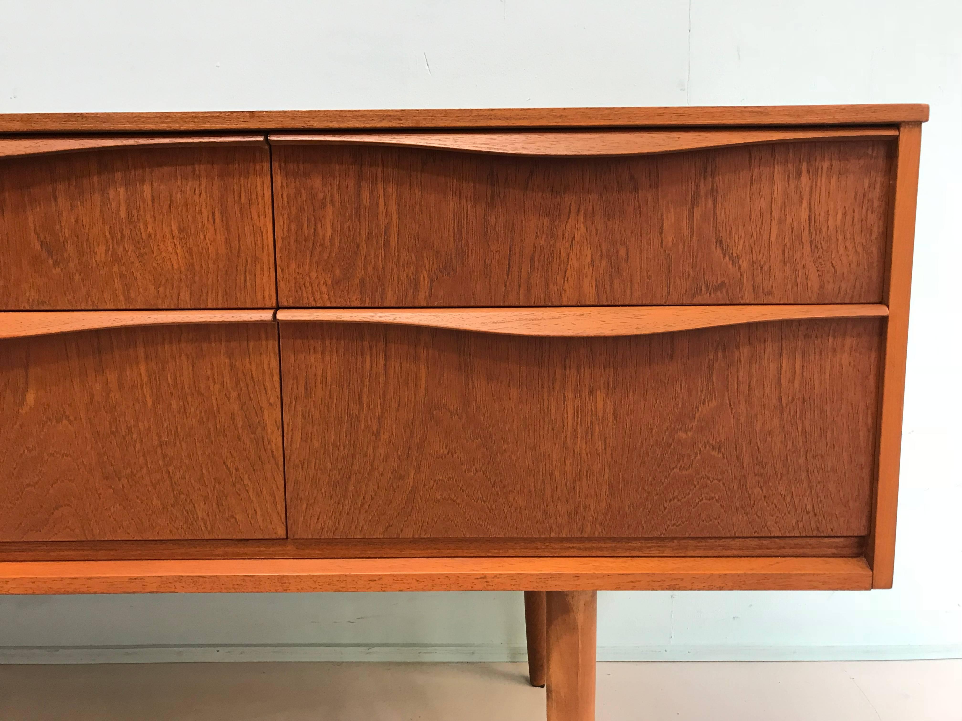 Six drawer dresser teak period 1960s England design by Frank Guille.
Condition: very good.
Measurements:
145 cm W, 42 cm D, 66 cm H.
Itemnr: 238.
