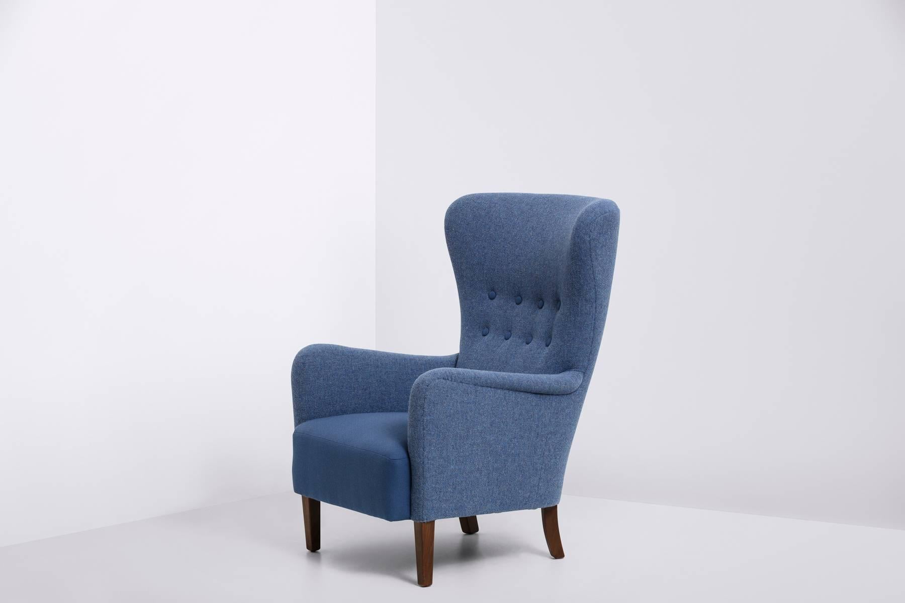 Wingback chair, legs of stained beech
two-toned blue wool by Kvadrat.