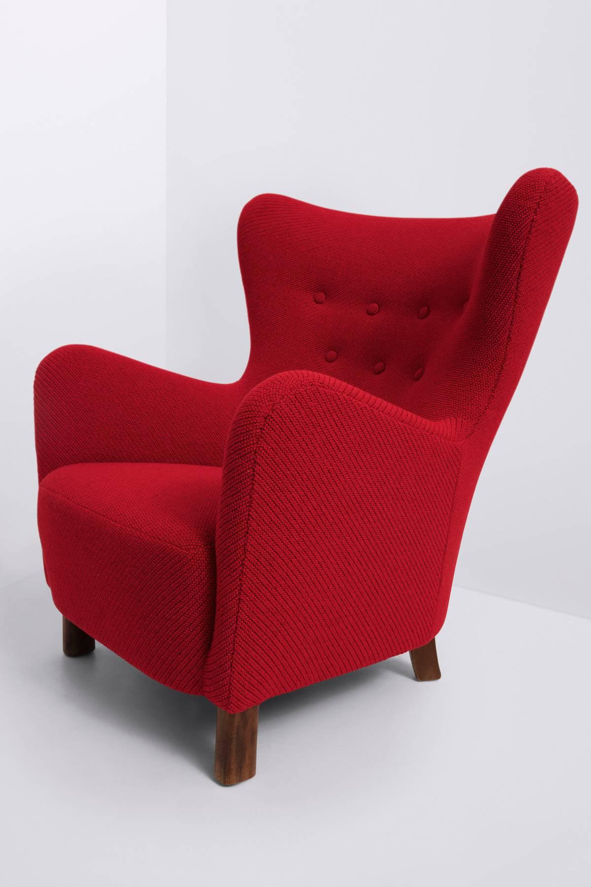 Legs of stained beech
Red wool upholstery by Kvadrat.
 