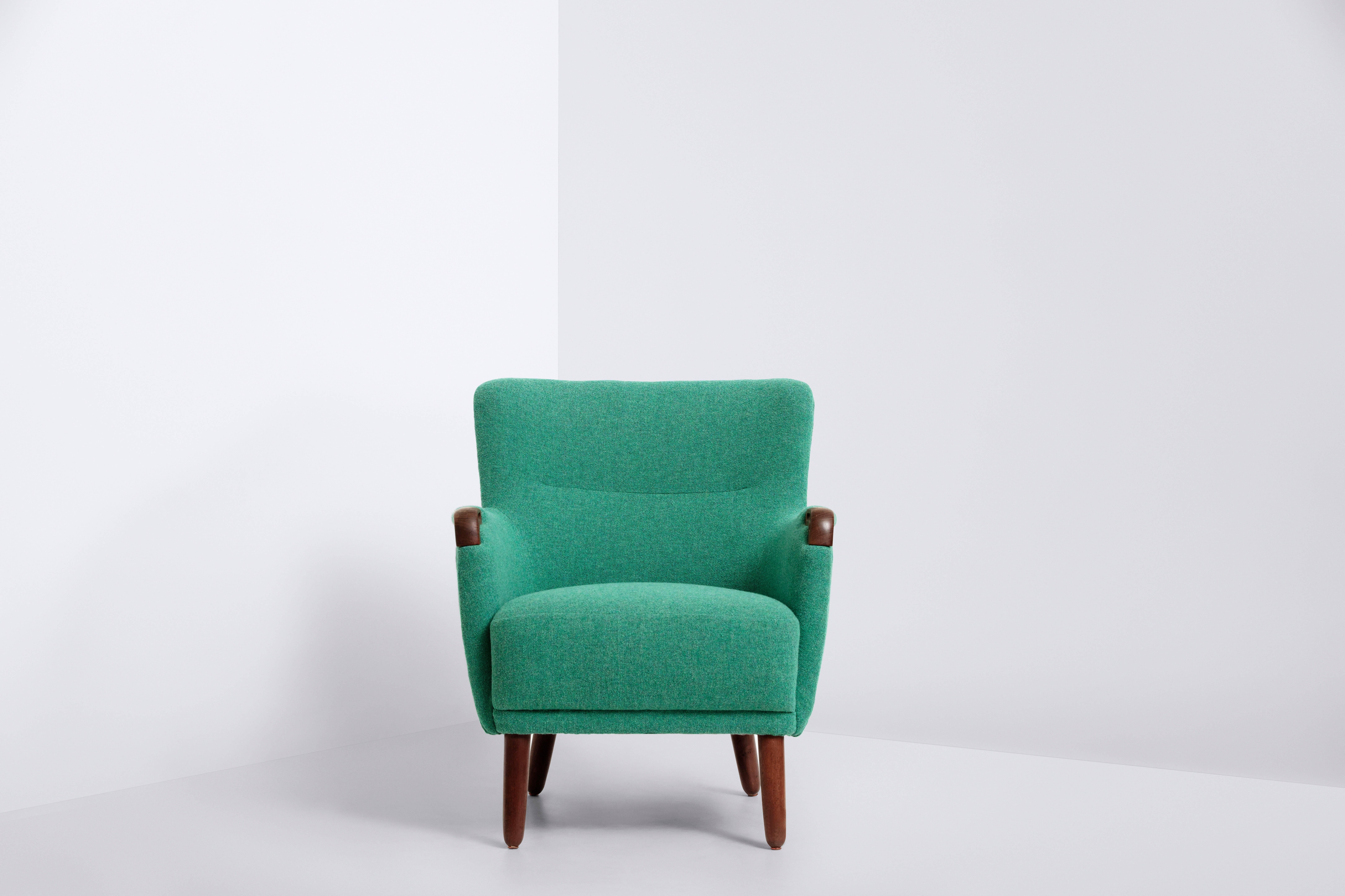 Frame of stained beech
Turquoise wool upholstery by Kvadrat.
 