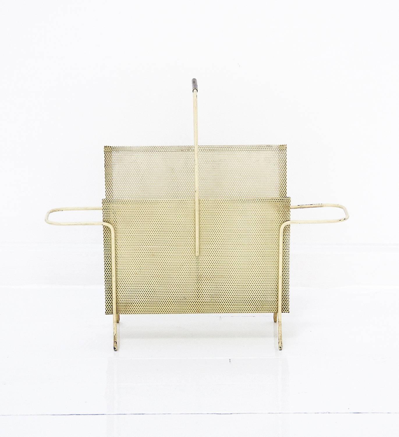 Magazine holder designed by Mathieu Matégot and manufactured by Ateliers Matégot in France. It is made of perforated folded metal in a very good original condition and preservating original patina,
circa 1950, France.

                