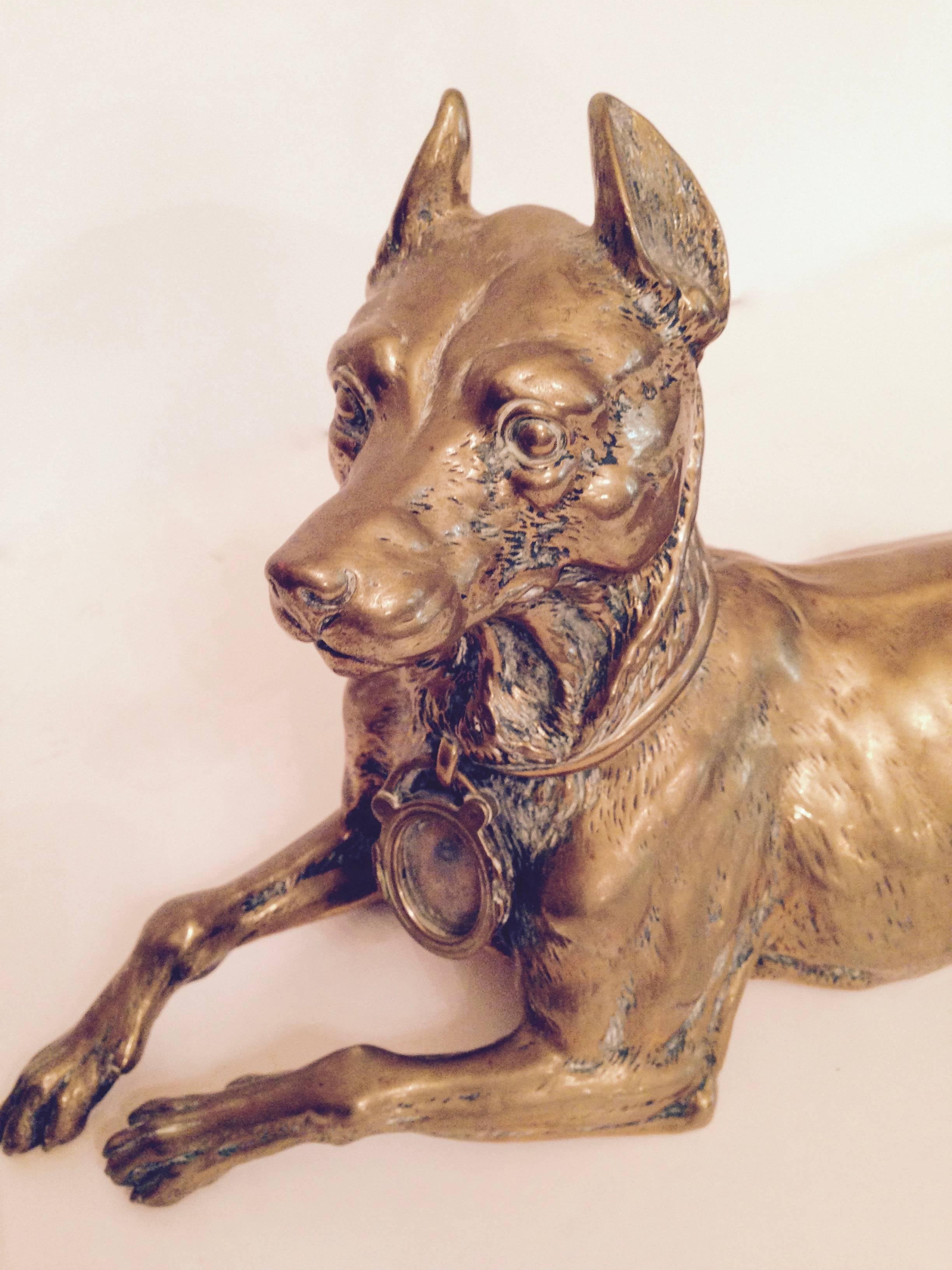 Very heavy 19th century French Bronze figure of a hound with a collar in Bronze around the neck with a glass fronted locket hanging.