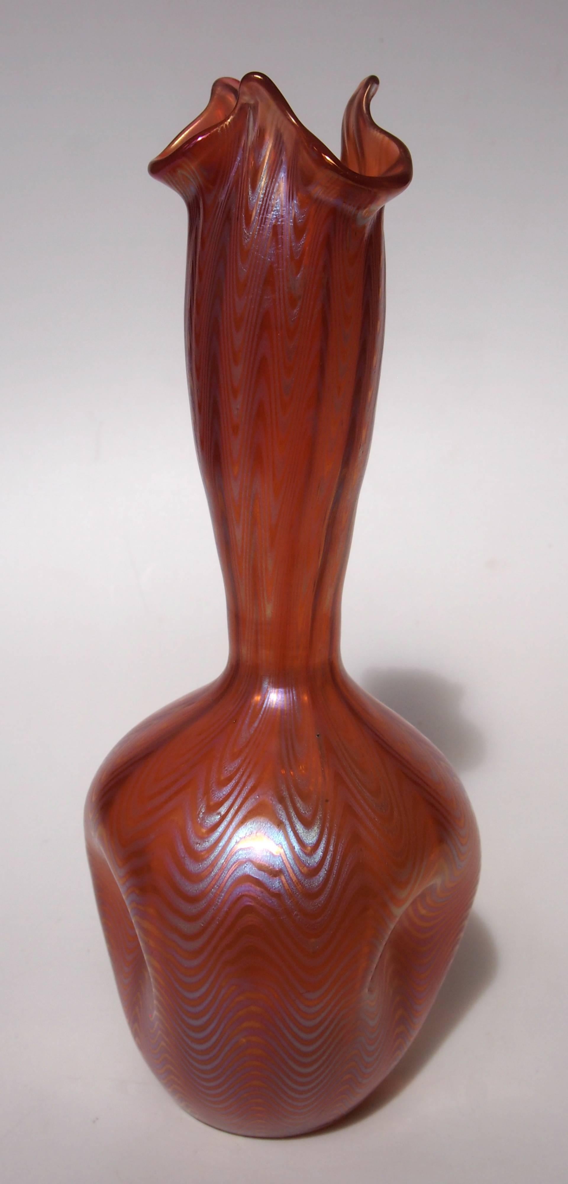 Stunning pulled and shaped Loetz Phaenomen vase in the Classic 6893 pattern but in the very rare orange finish

Loetz was probably the finest European iridised glass maker of the Art Nouveau period and is highly collected world-wide. The Loetz