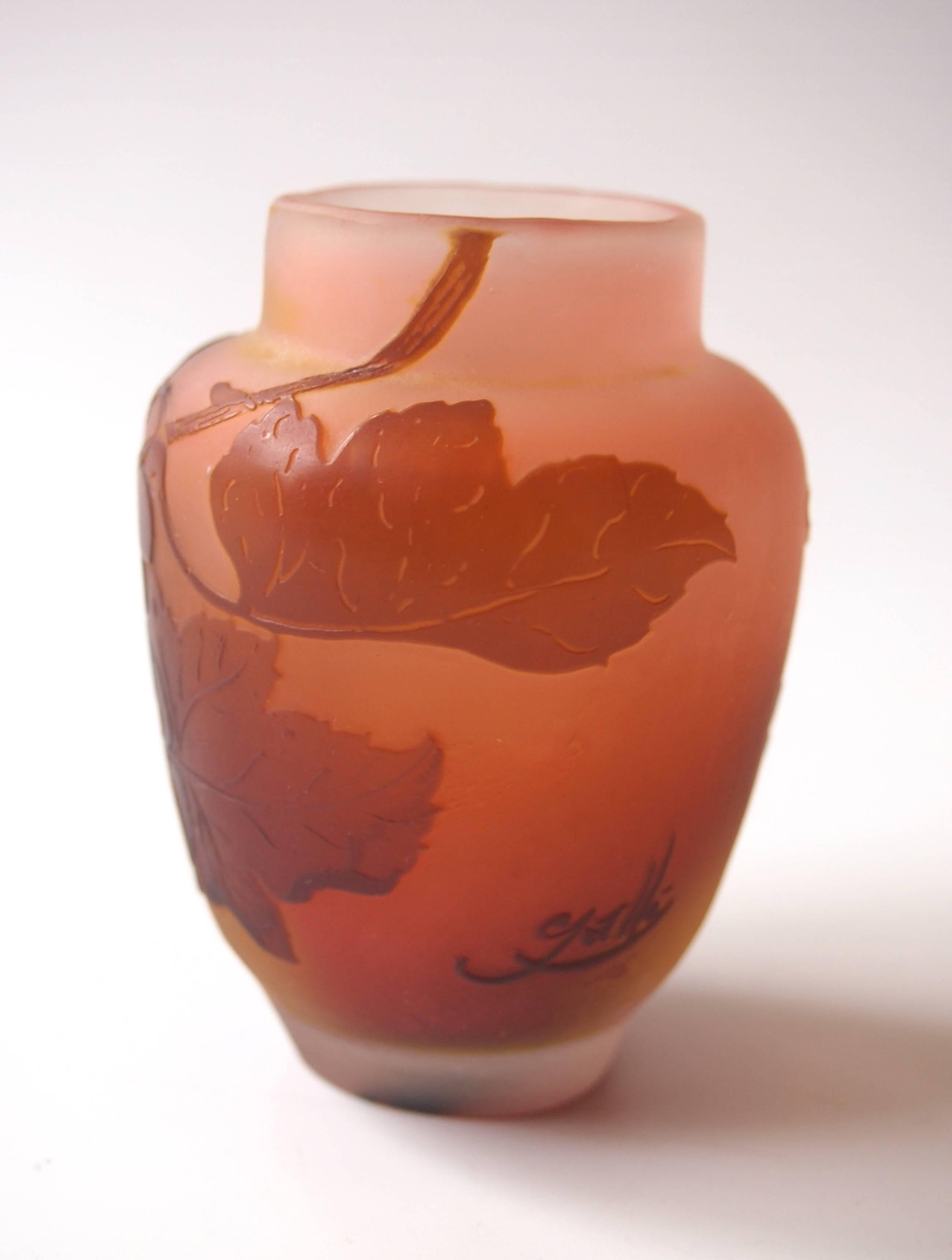 A very rare Art Nouveau Emile Galle Cameo miniature vase in brown over pink depicting sinuous grape vines signed in cameo, Galle loved trailing vines with twisty fronds and any botanical image where he could show off his skills as a fine cameo