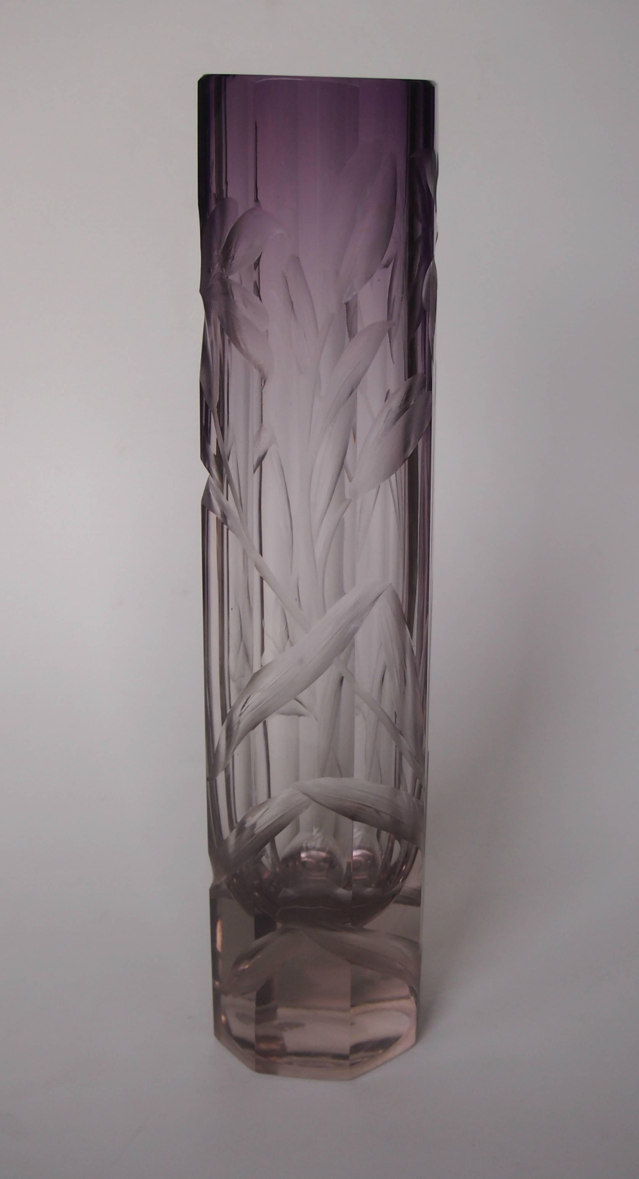 A super purple cut to clear Moser intaglio cut vase, circa 1900 profusely cut with flowers and curved leaves. Ludwig Moser called this technique 'Eckentiefgravur' and employed many of the greatest cutters in Bohemia to produce this look. The 'color