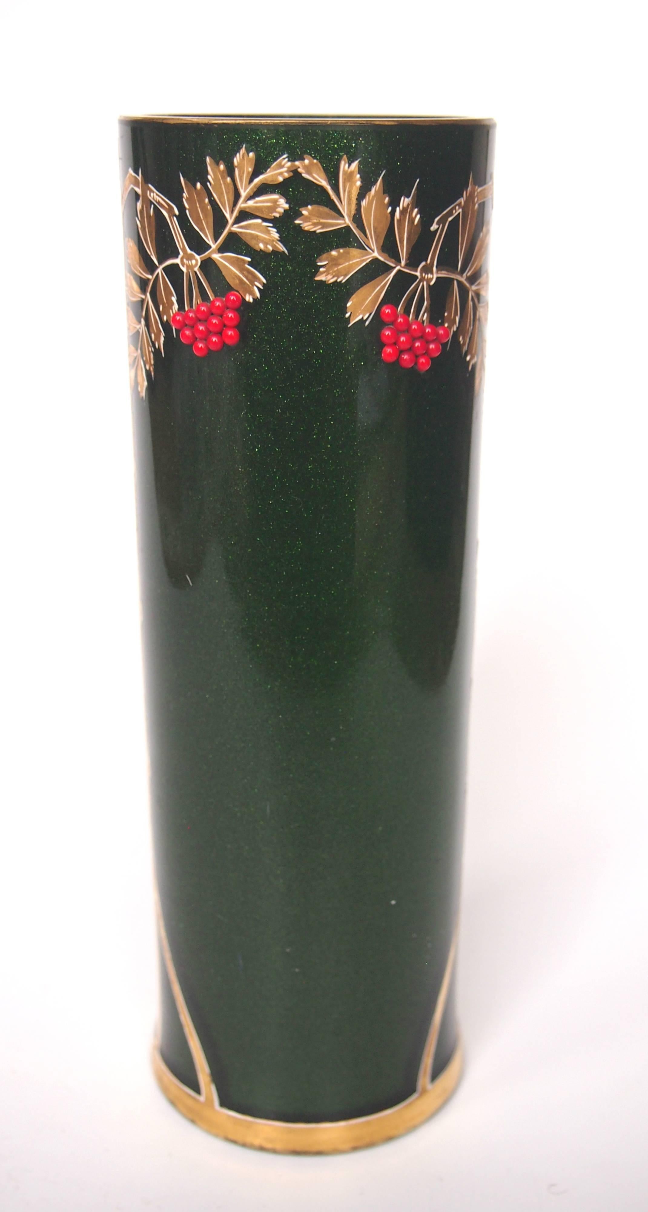 A super large Riedel vase in green aventurine (a sparkly green) with gilding over white enamel and tiny applied red glass beads. Riedel used a combination of the European styles of the time merging elements of Art Nouveau, Jugendstil and Vienna
