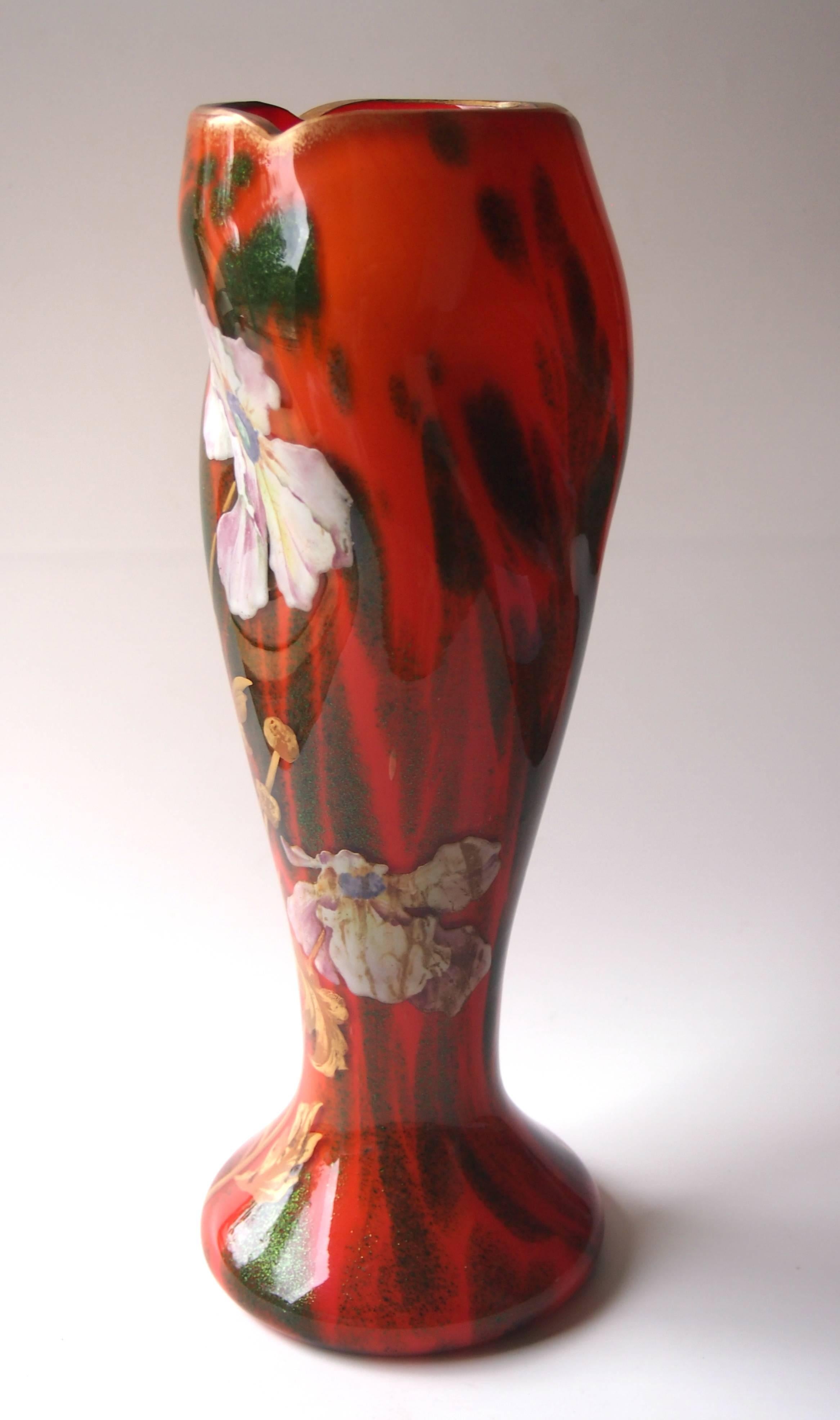 Art Nouveau vase by Harrach in a rare and unusual colourway - opaque orange cased with green aventurine - Harrach were the only company to be known to use this colour combination. The vase is gilded and enamelled with flowers.

Harrach has been