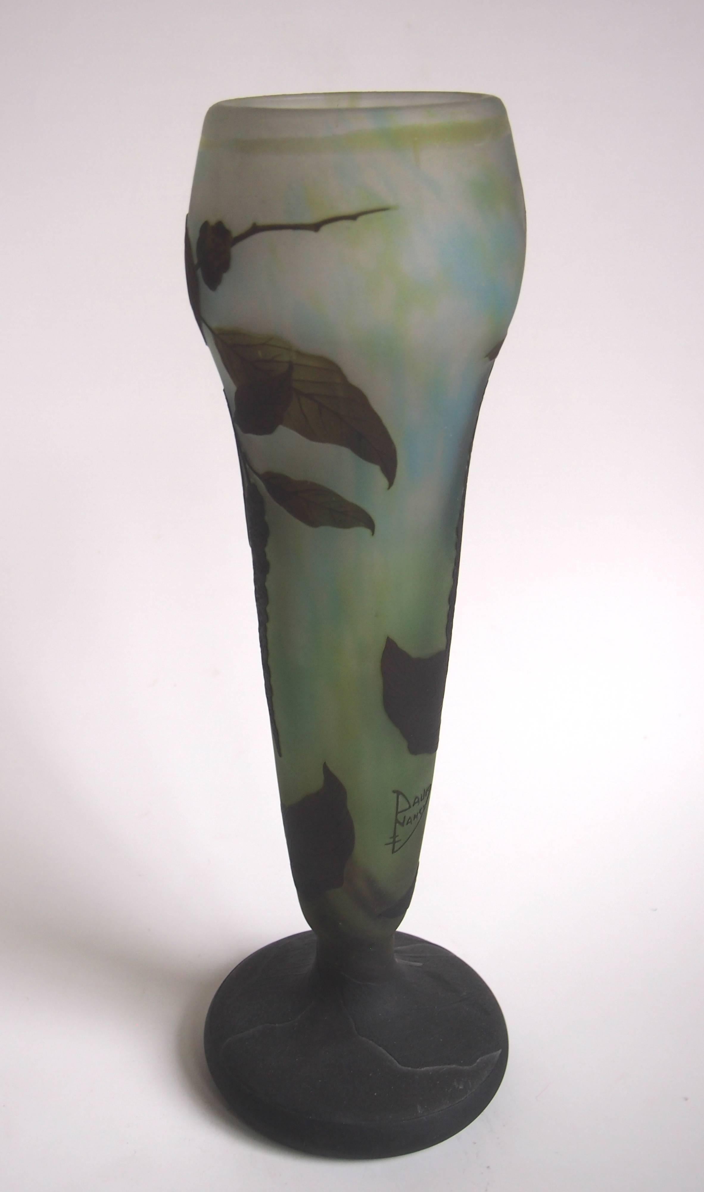 Dramatic Daum Nancy Cameo vase, depicting a large trailing seed pod plant in blues, greens and brown/black with very detail carved black foot (see image 6). Signed (image 2).

Daum (along with Galle) was one of the two greatest glass works of France