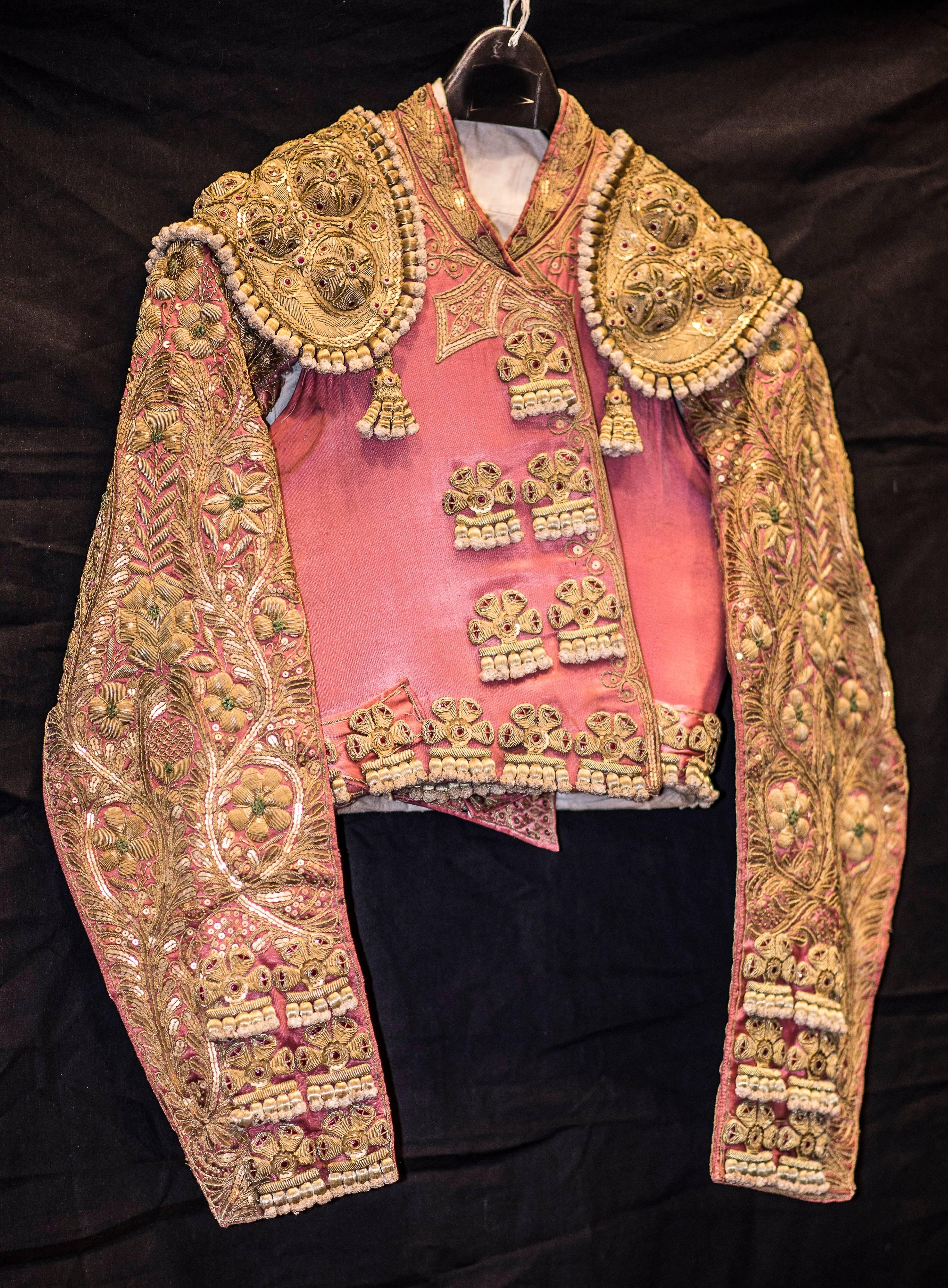 One of a kind matador costume in silk embroidered in gold from a Madrid workshop. Consists of three pieces, vest, gillet and trousers. The owner was a known 
Matador and stockbreeder from Salamanca, Spain. Size 38.
 