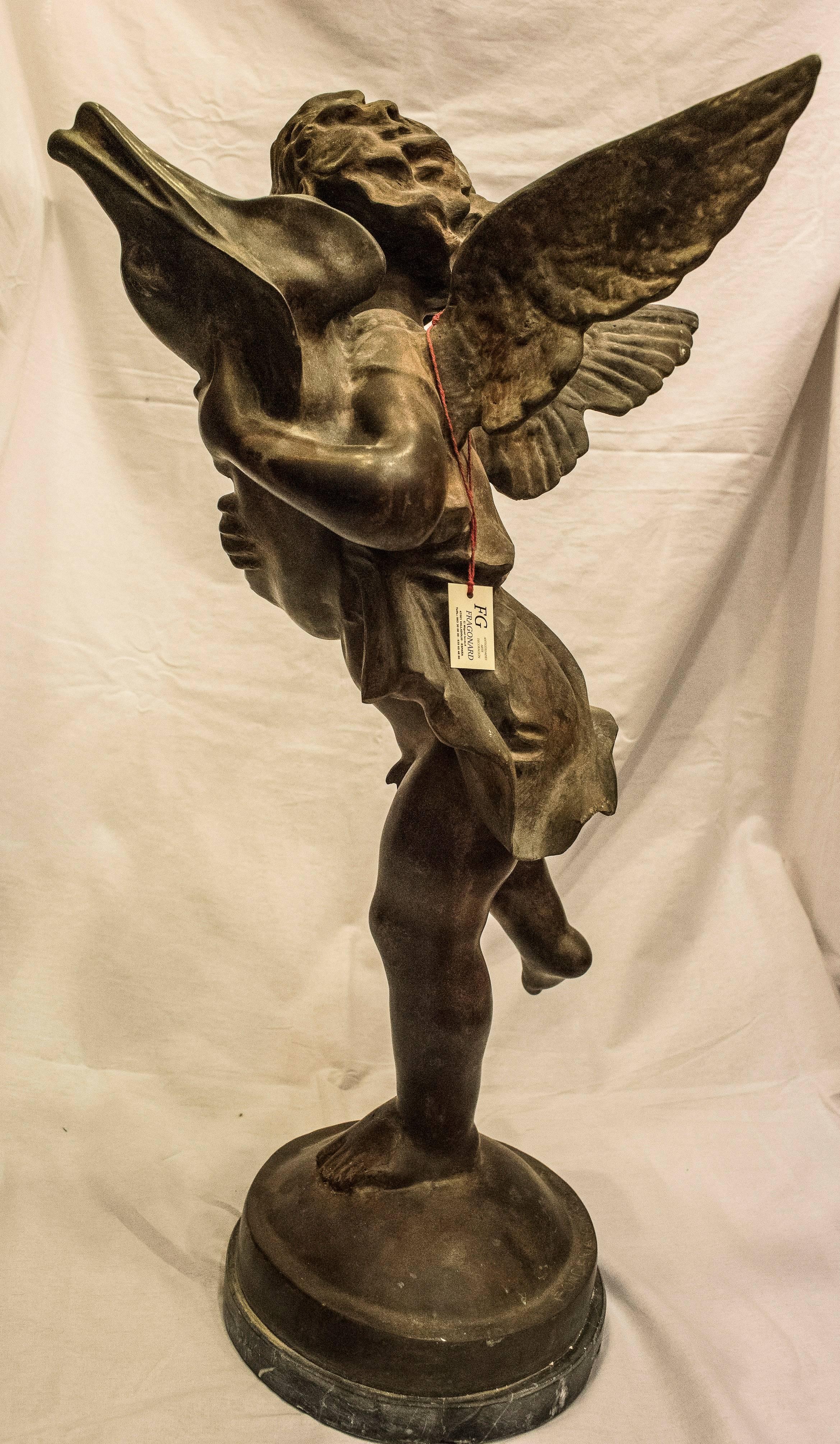A French patinated bronze sculpture named “Putti with a dolphin” from Napoleon III period in the 19th century in a good condition.